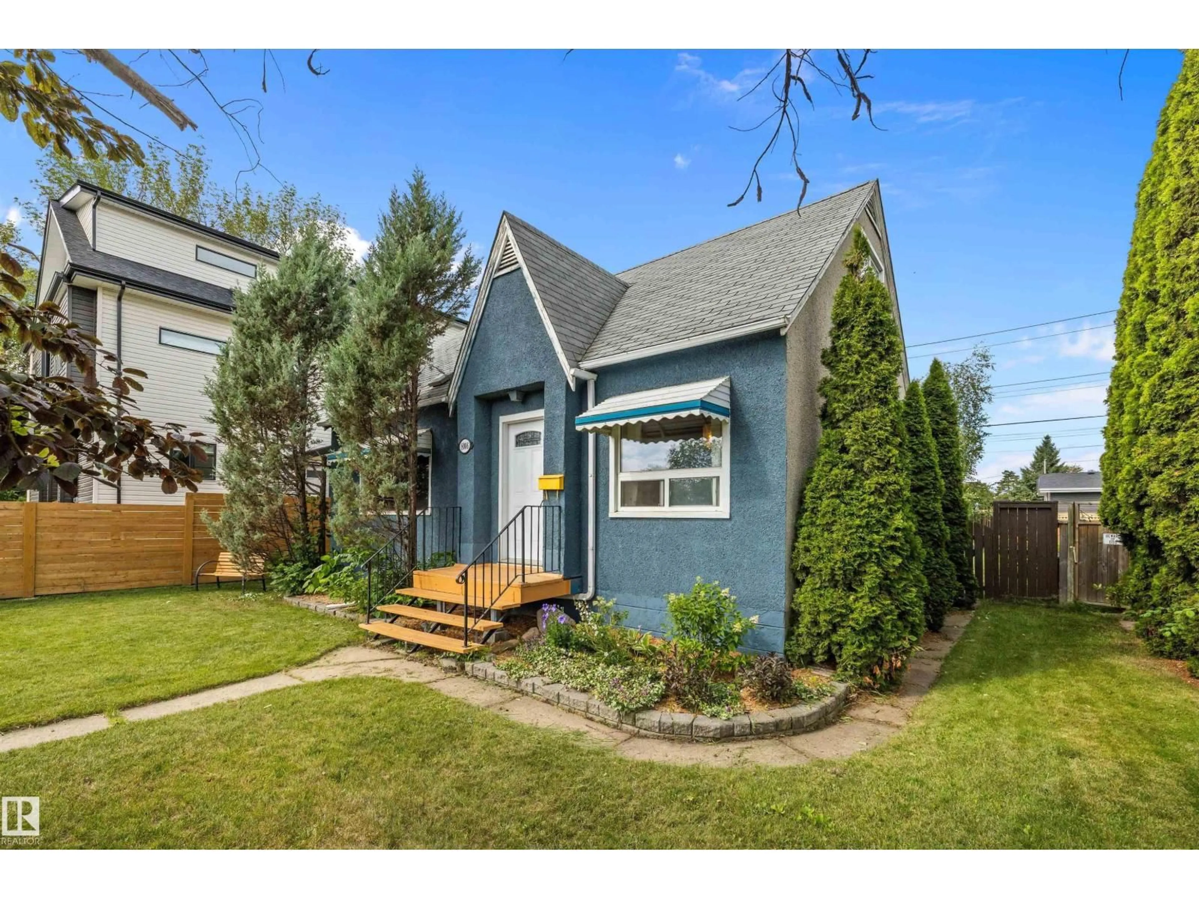 Home with vinyl exterior material, street for 8006 75 ST, Edmonton Alberta T6C2G7