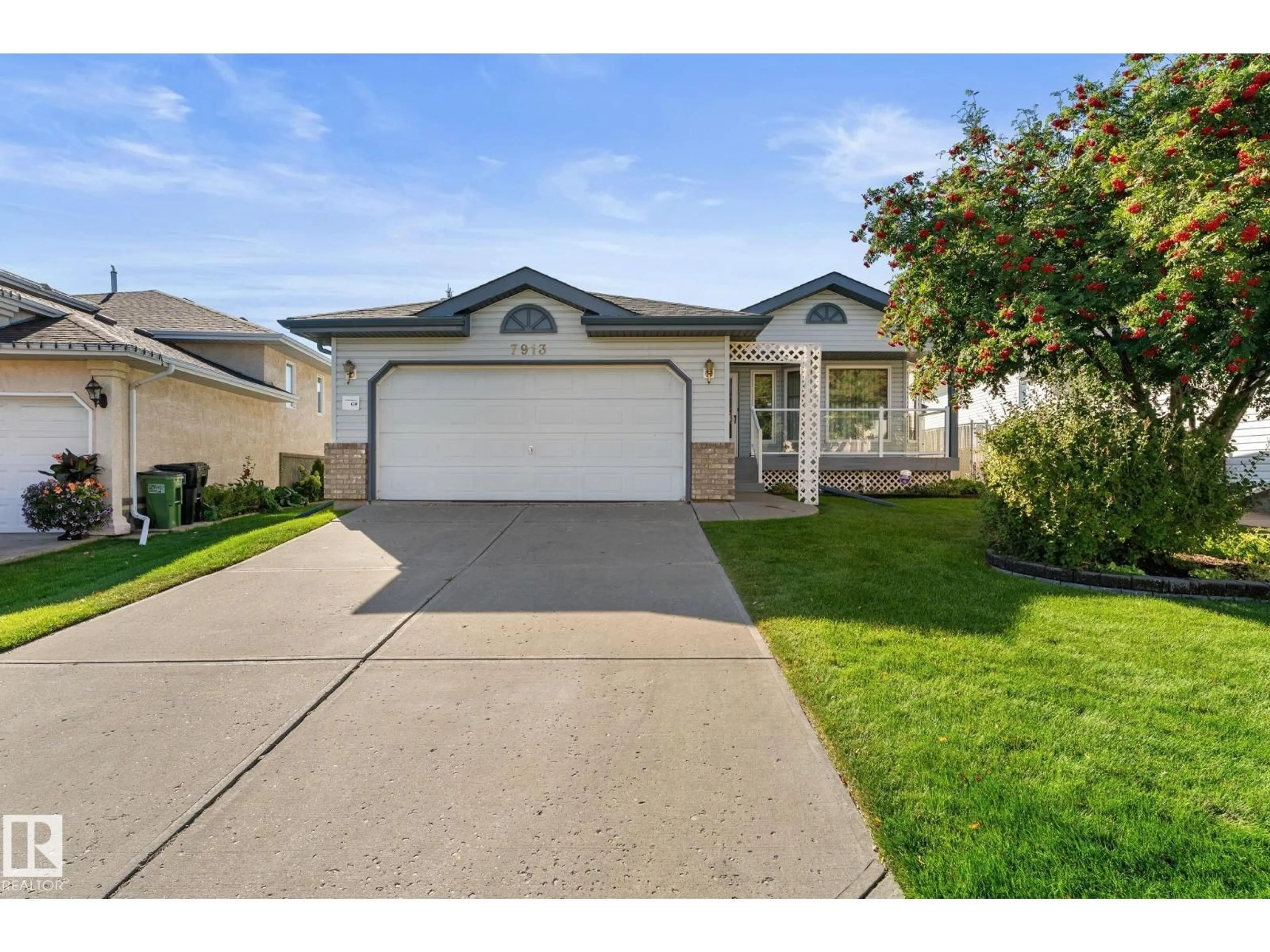 Home with vinyl exterior material, street for 7913 161 AV, Edmonton Alberta T5Z3E9