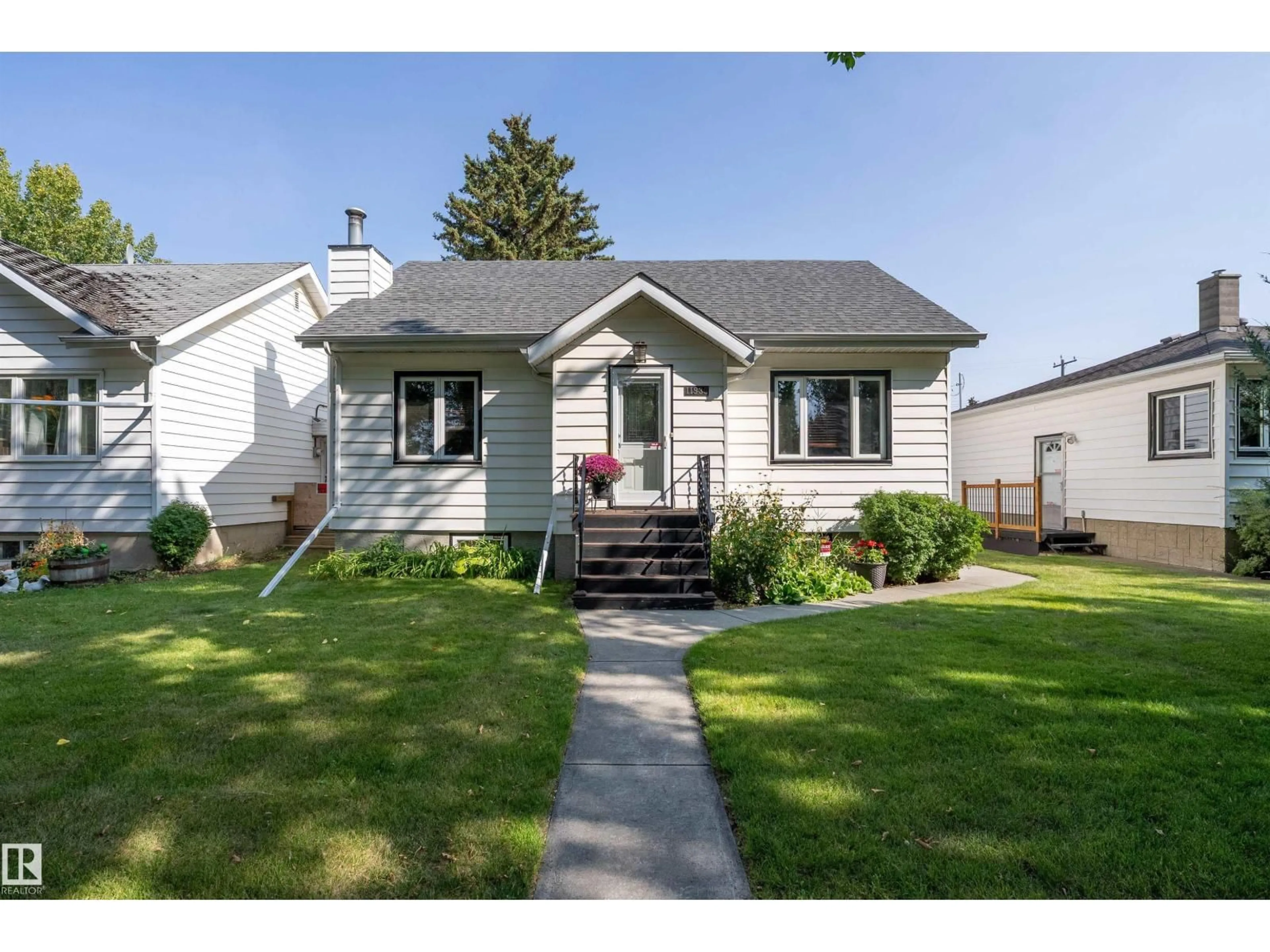 Home with vinyl exterior material, street for 11939 68 ST, Edmonton Alberta T5B1P8