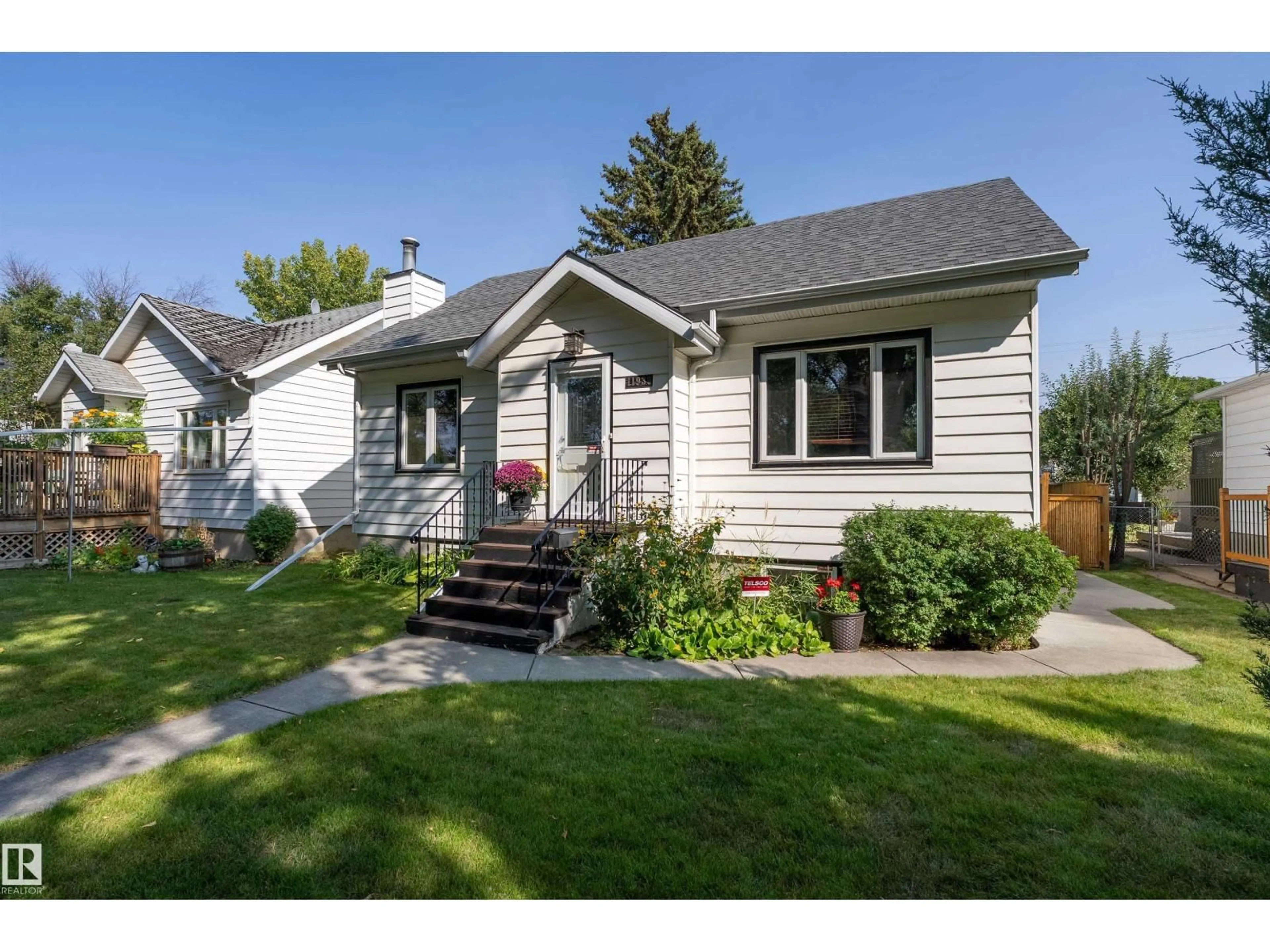 Home with vinyl exterior material, street for 11939 68 ST, Edmonton Alberta T5B1P8
