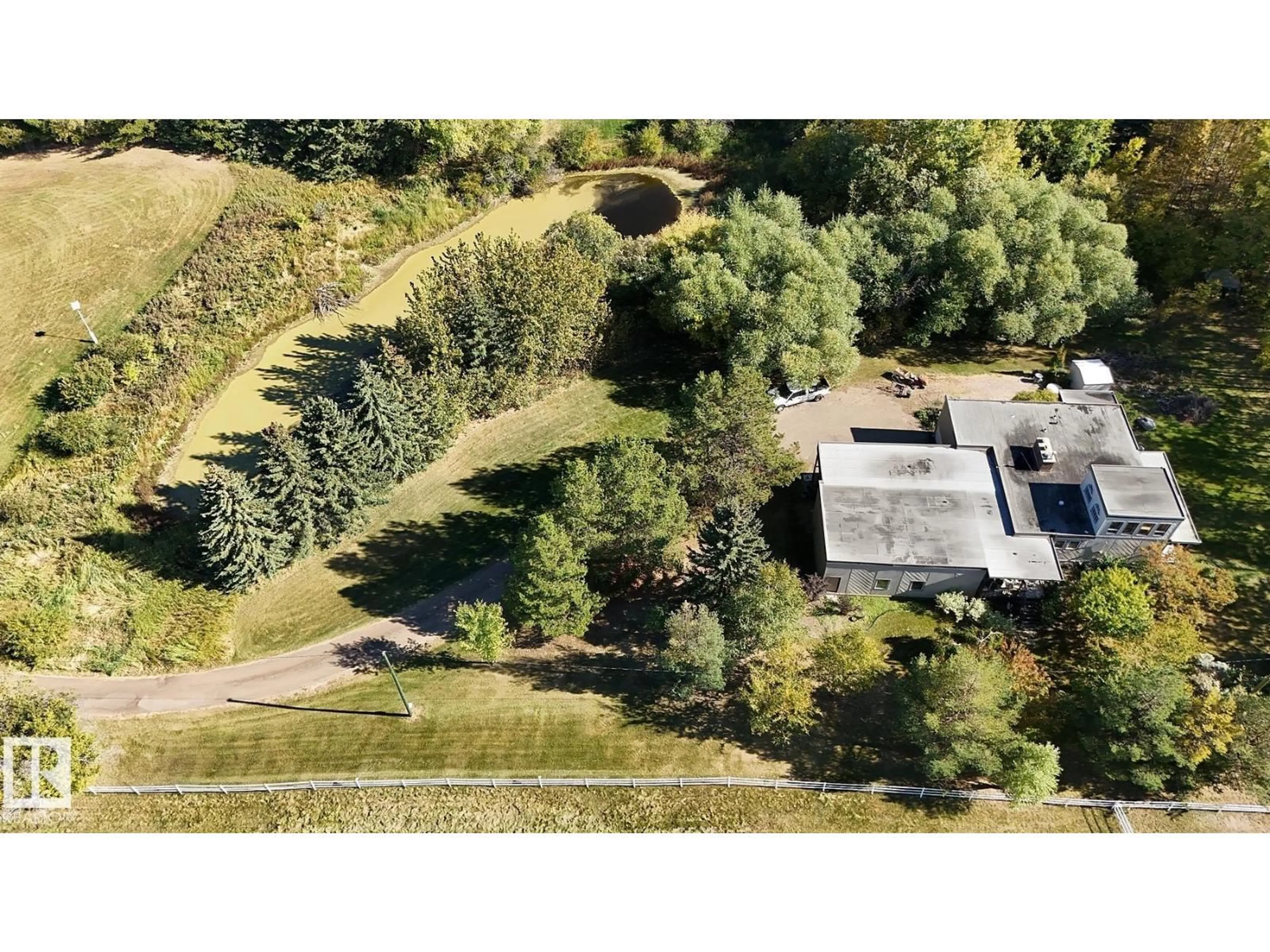 A pic from outside/outdoor area/front of a property/back of a property/a pic from drone, unknown for 61 23045 TWP ROAD 514, Rural Strathcona County Alberta T8B1K9
