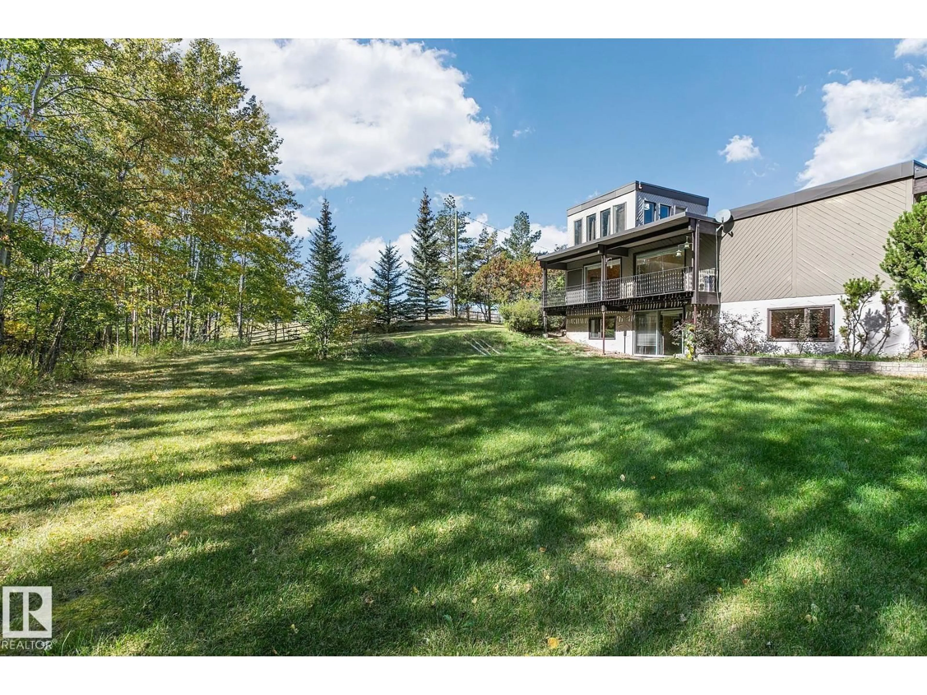 A pic from outside/outdoor area/front of a property/back of a property/a pic from drone, mountain view for 61 23045 TWP ROAD 514, Rural Strathcona County Alberta T8B1K9
