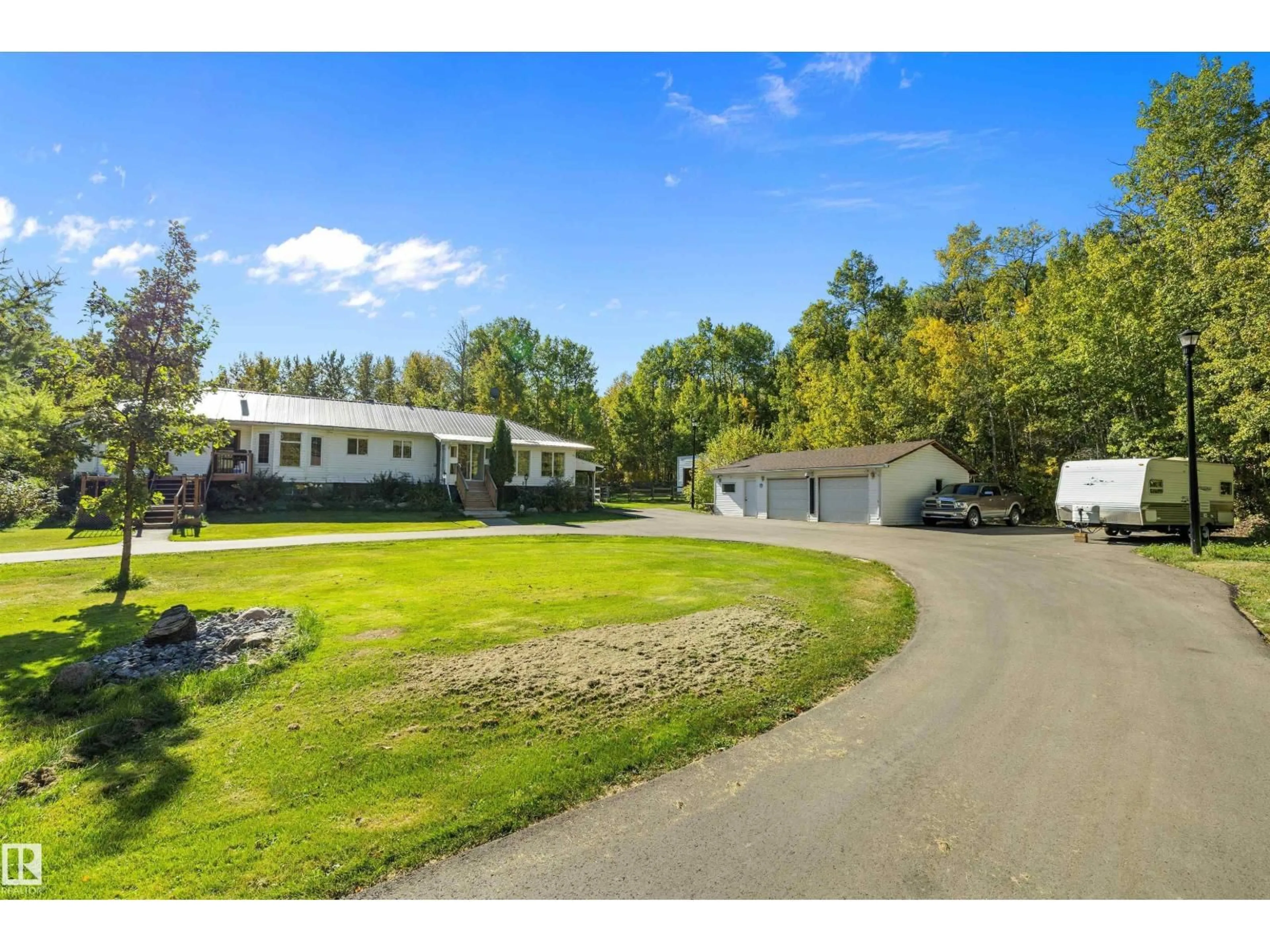 A pic from outside/outdoor area/front of a property/back of a property/a pic from drone, unknown for #4 - 54113 RGE ROAD 13, Rural Parkland County Alberta T7Y0J2