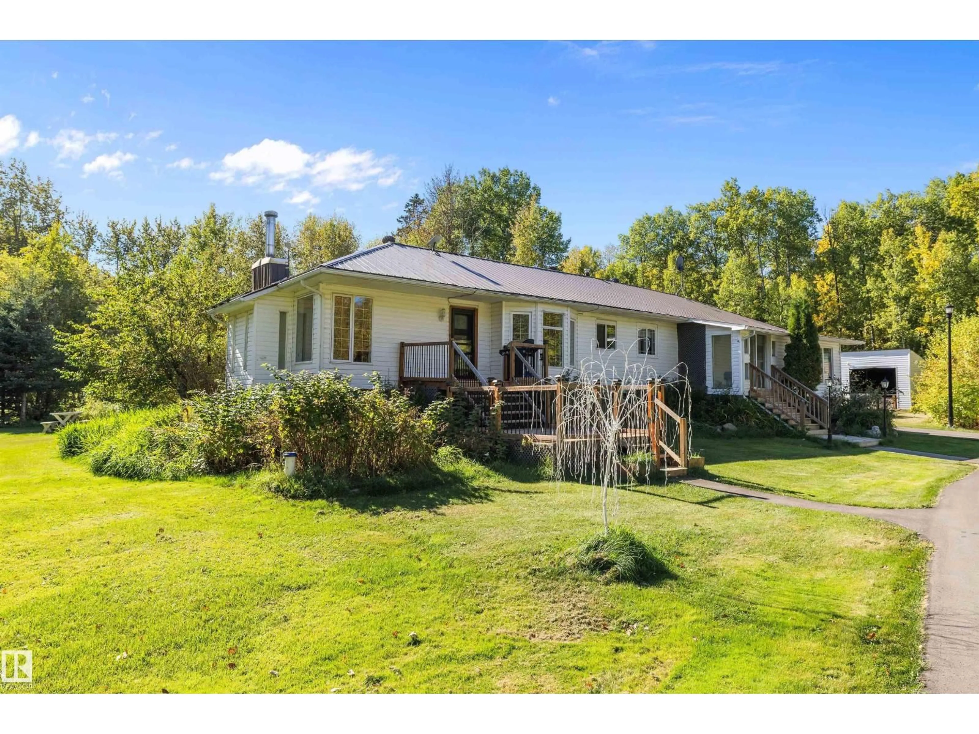 A pic from outside/outdoor area/front of a property/back of a property/a pic from drone, unknown for #4 - 54113 RGE ROAD 13, Rural Parkland County Alberta T7Y0J2