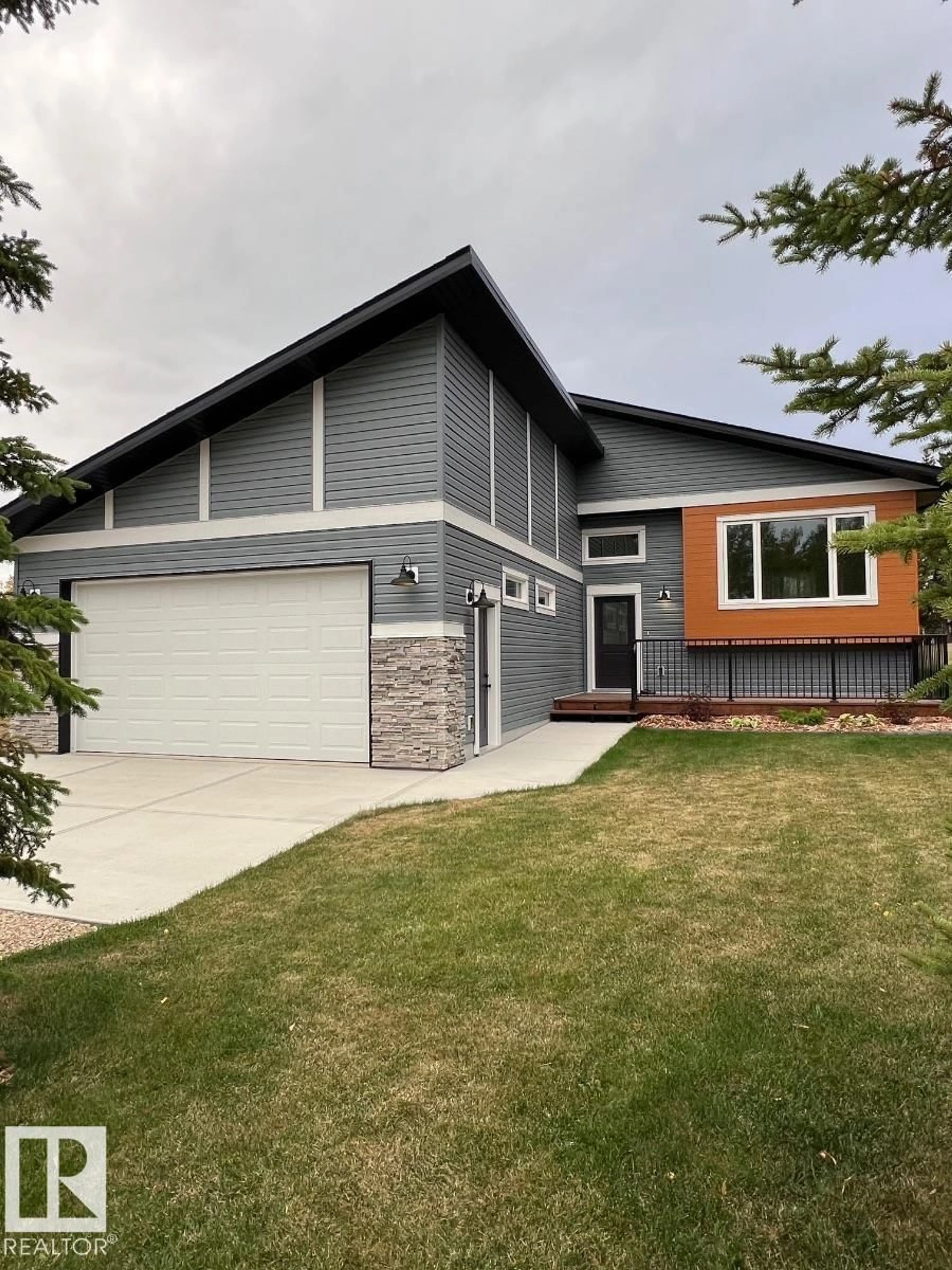 Home with vinyl exterior material, street for 102 1 ST, Rural Lac Ste. Anne County Alberta T0E1A0