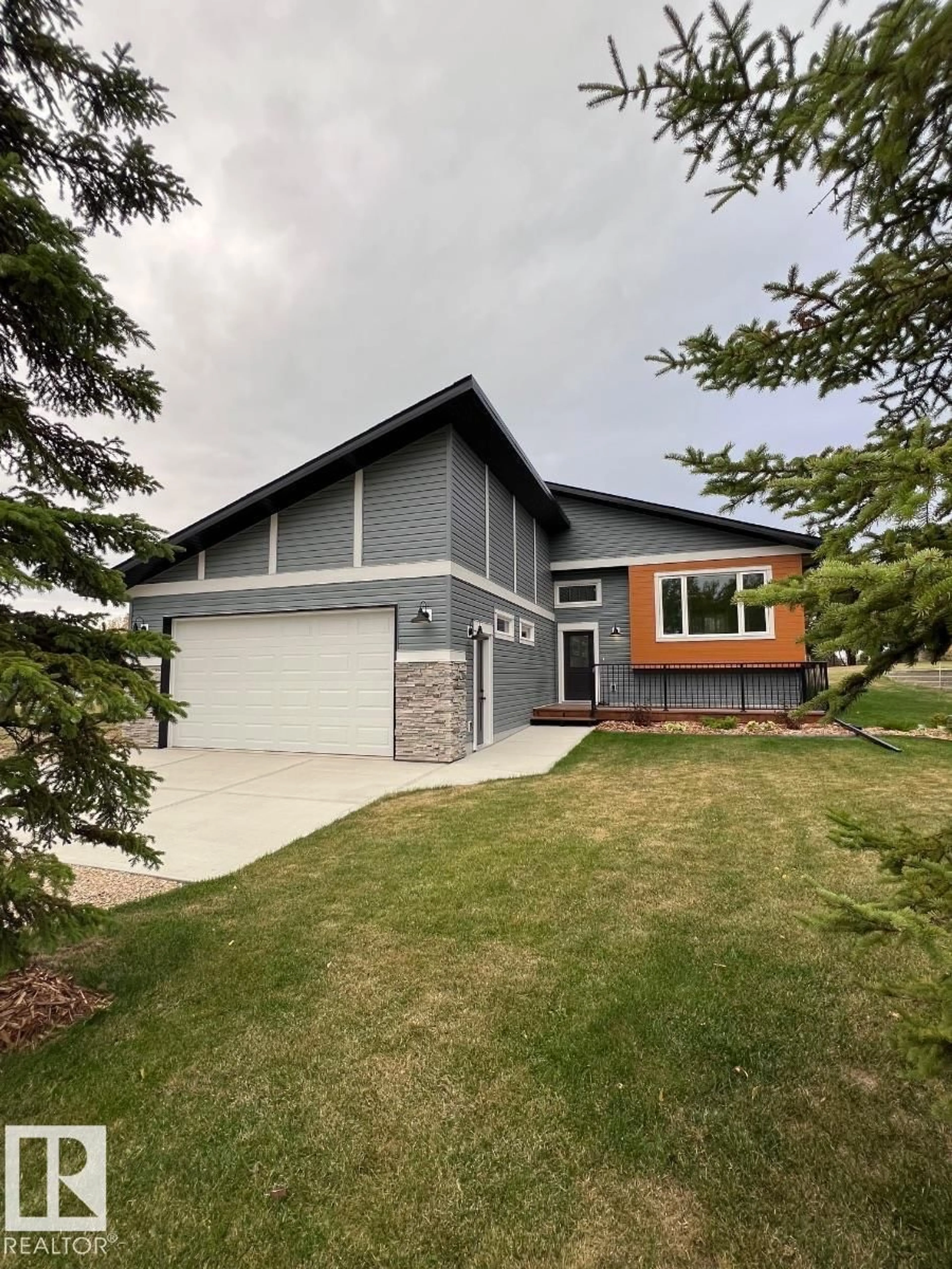 Home with vinyl exterior material, street for 102 1 ST, Rural Lac Ste. Anne County Alberta T0E1A0