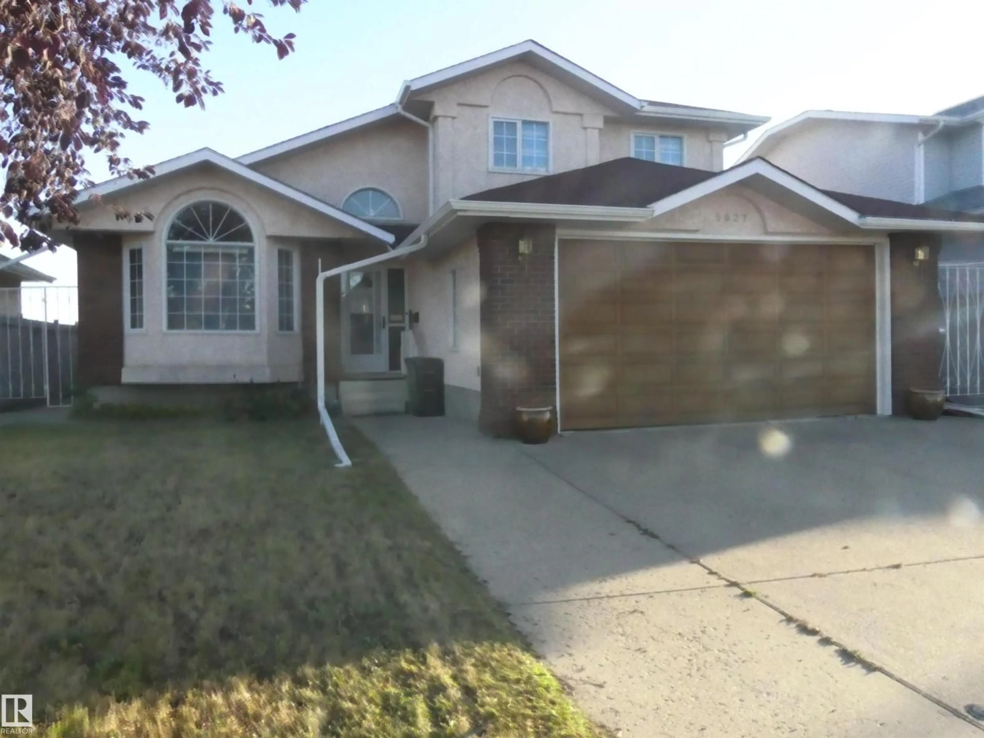 Home with vinyl exterior material, street for NW - 9827 175 AV, Edmonton Alberta T5X5V4