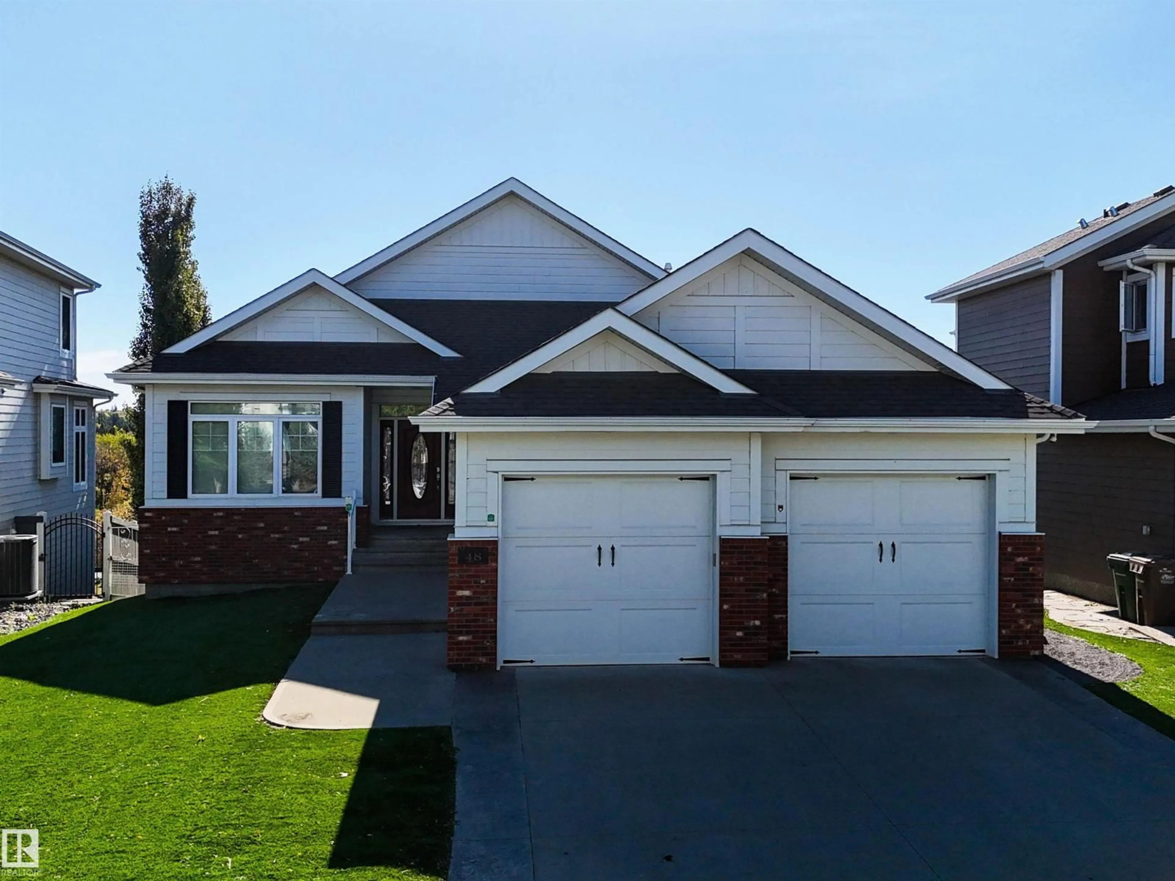 Home with vinyl exterior material, street for 48 ORCHARD CO, St. Albert Alberta T8N4K2