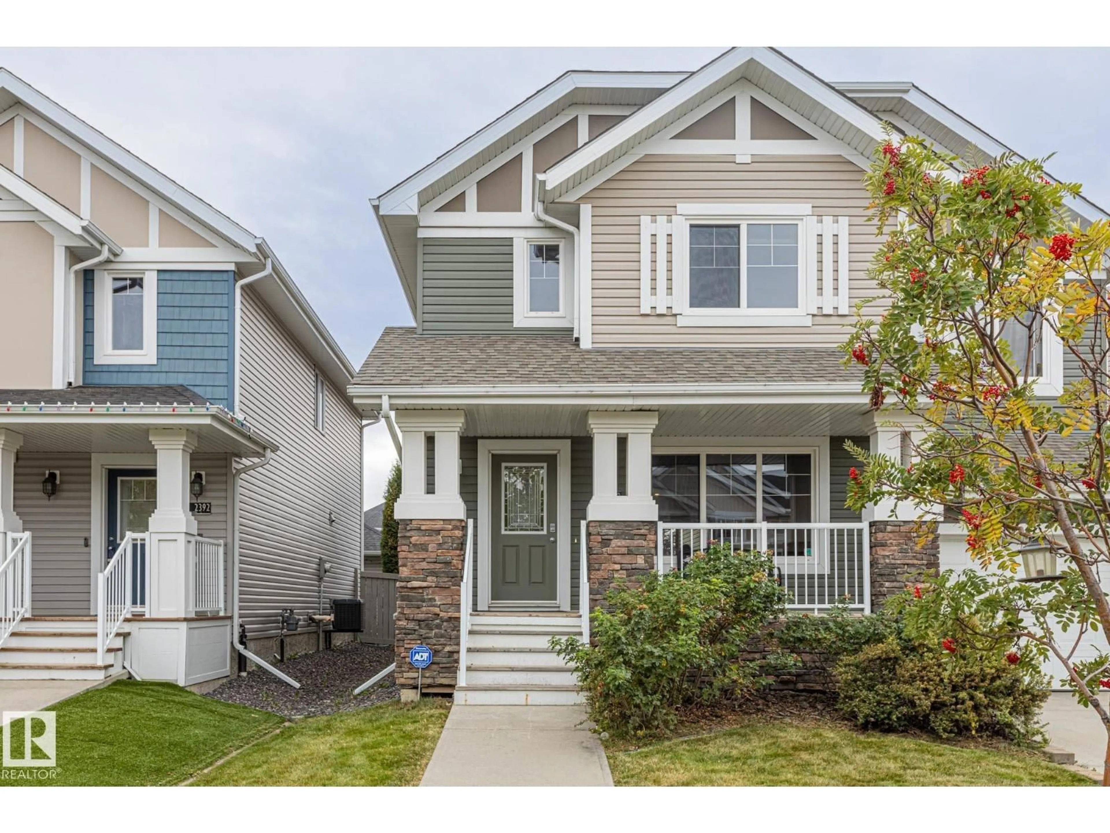 Home with vinyl exterior material, street for 2390 SPARROW CR, Edmonton Alberta T5S0G6