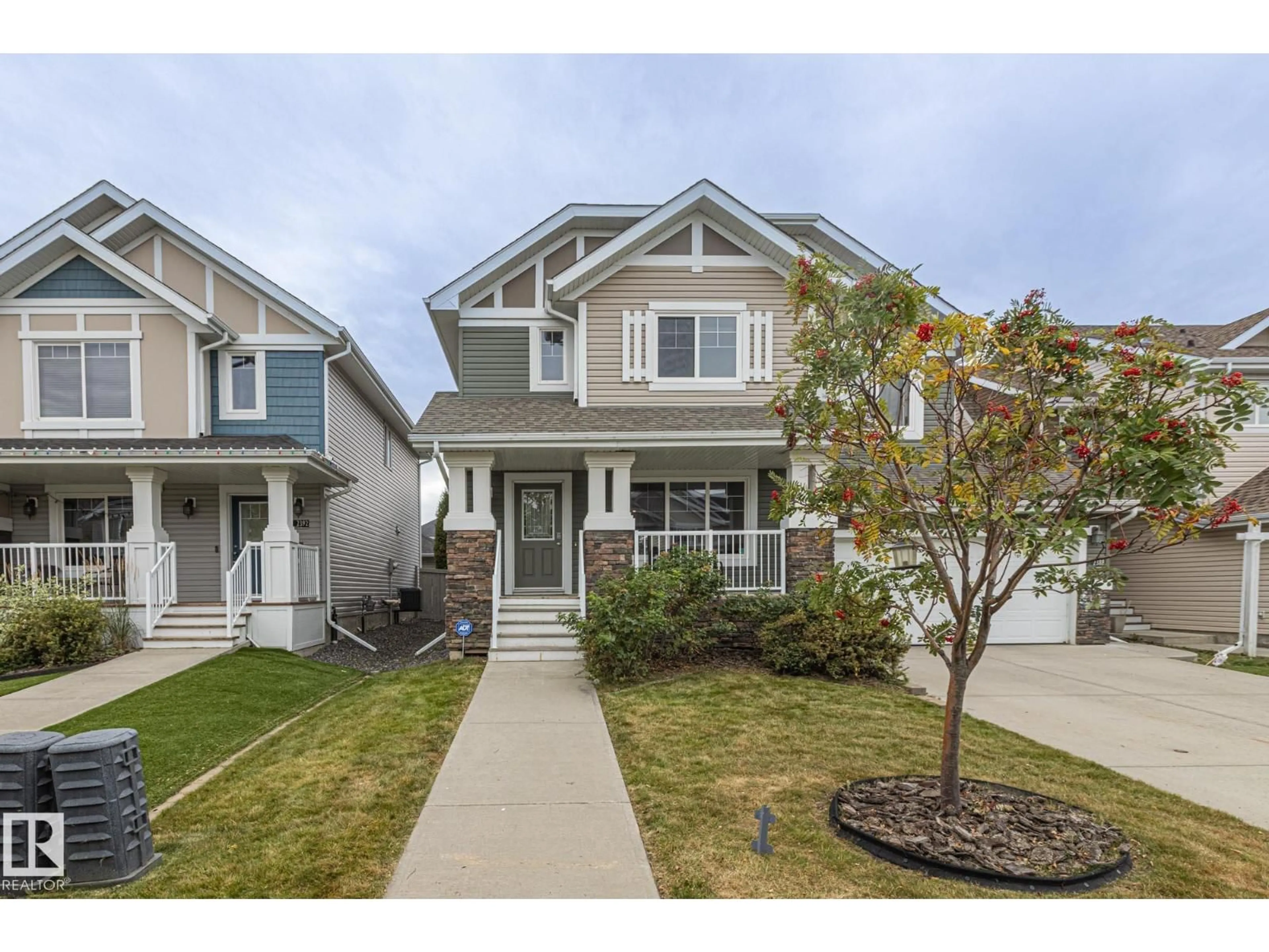 Home with vinyl exterior material, street for 2390 SPARROW CR, Edmonton Alberta T5S0G6