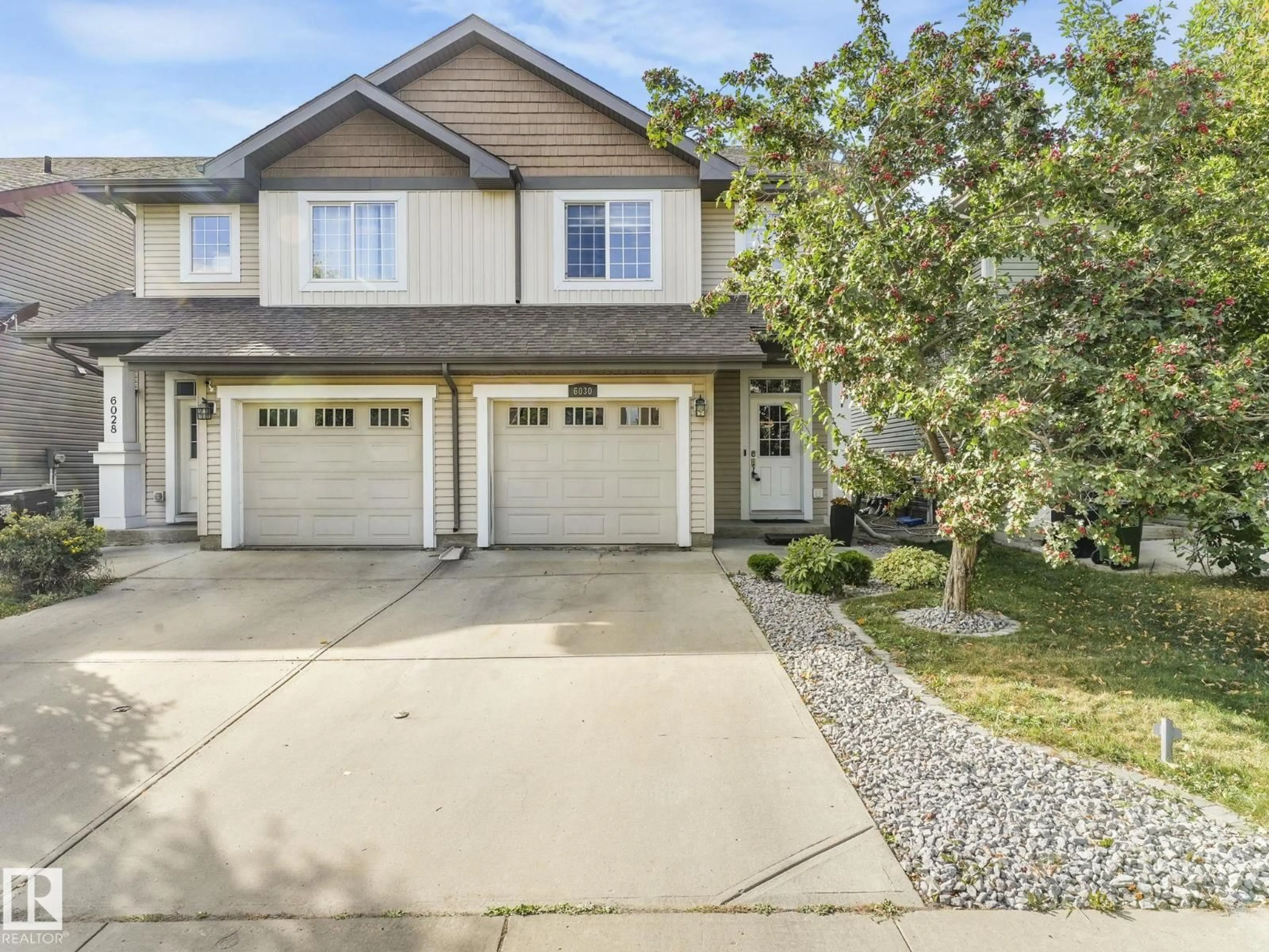 Home with vinyl exterior material, street for NW - 6030 214 ST, Edmonton Alberta T6M0H8