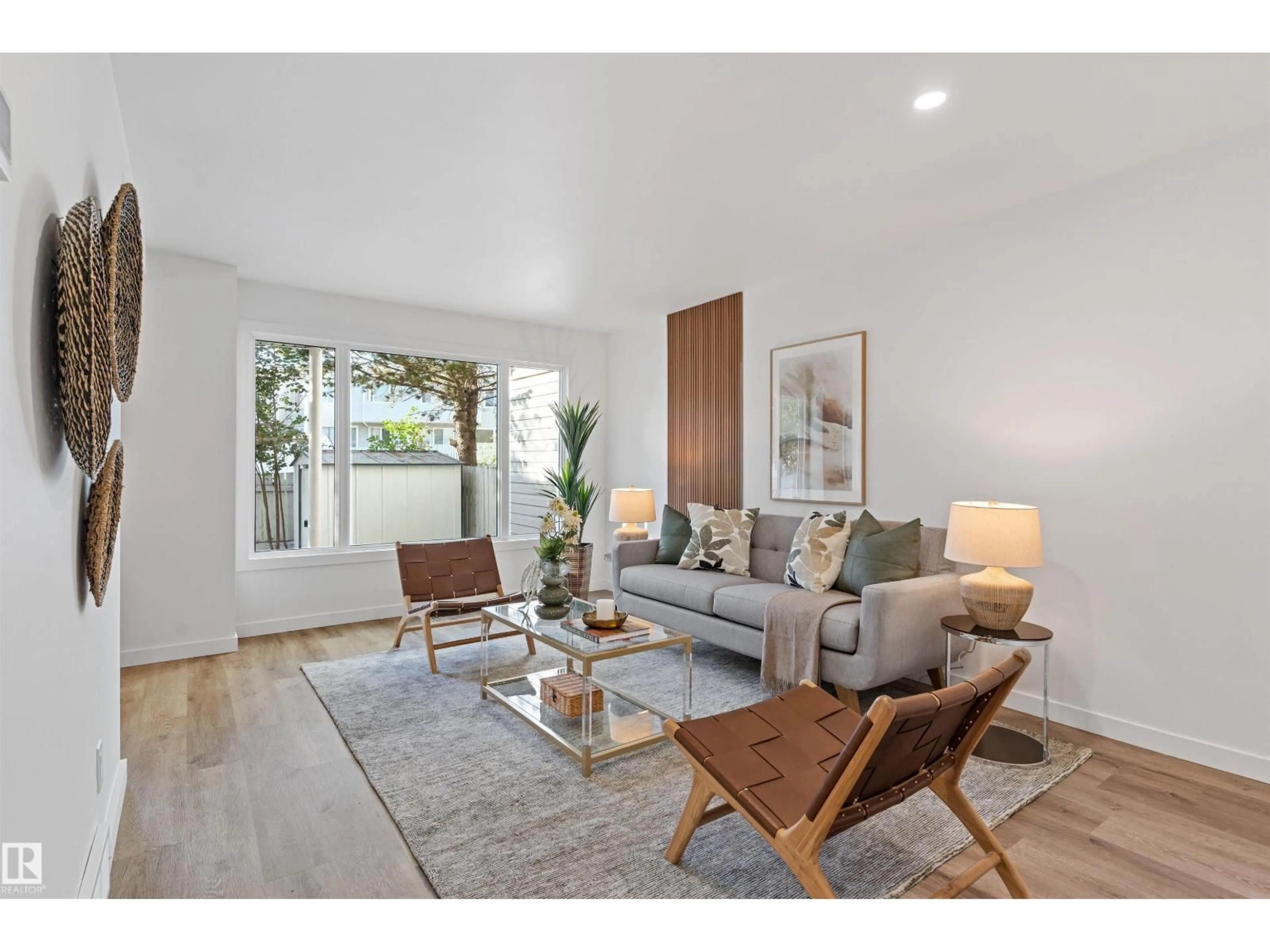 Living room with furniture, wood/laminate floor for 70 AMBERLY CT, Edmonton Alberta T5A0H9