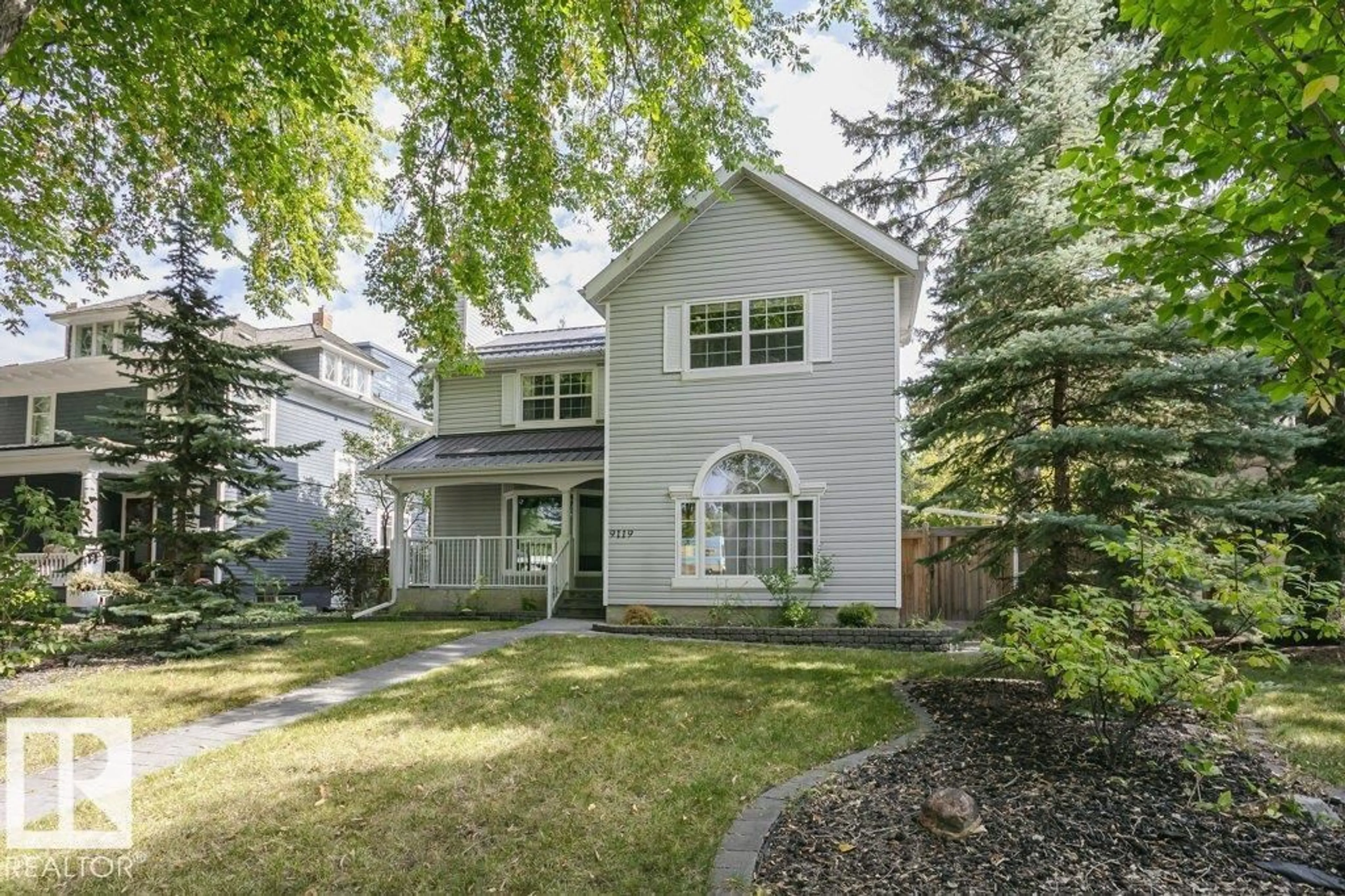 Home with vinyl exterior material, street for NW - 9119 117 ST, Edmonton Alberta T6G1S1