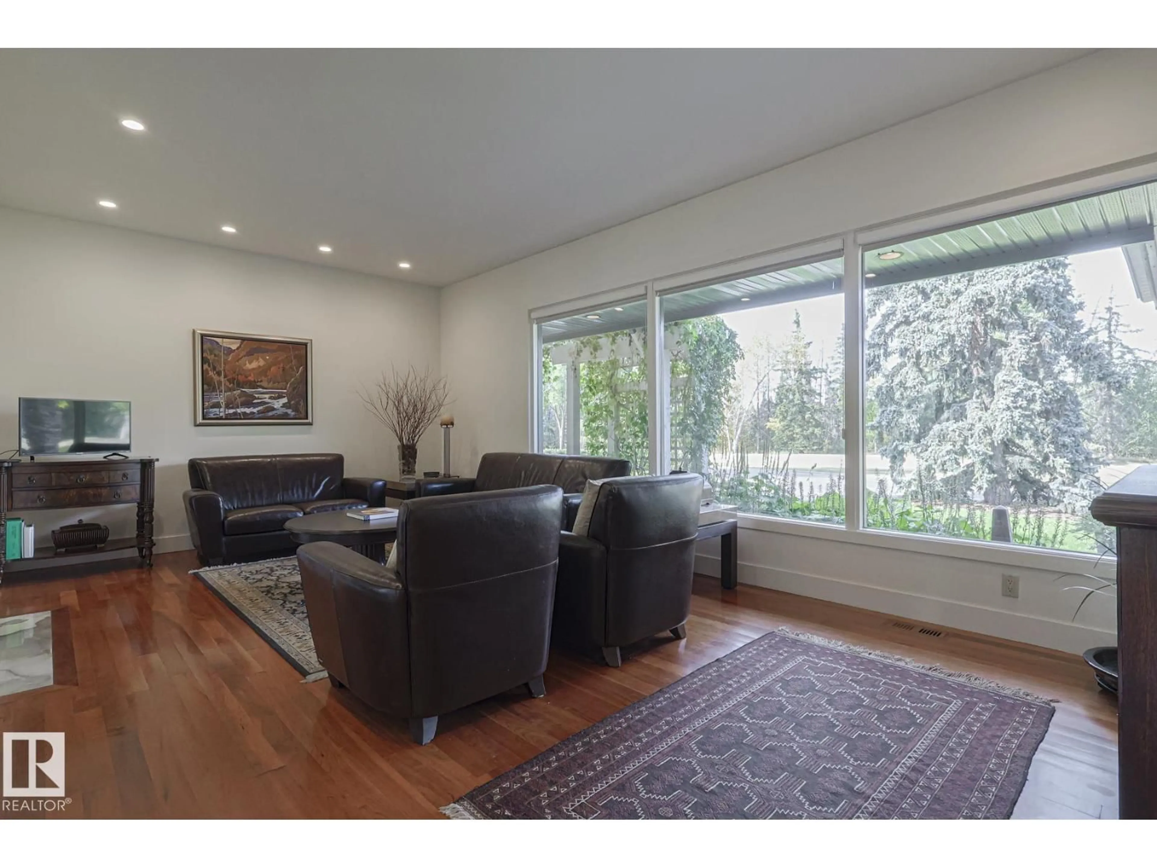 Living room with furniture, wood/laminate floor for 13817 SUMMIT DR, Edmonton Alberta T5N3S8