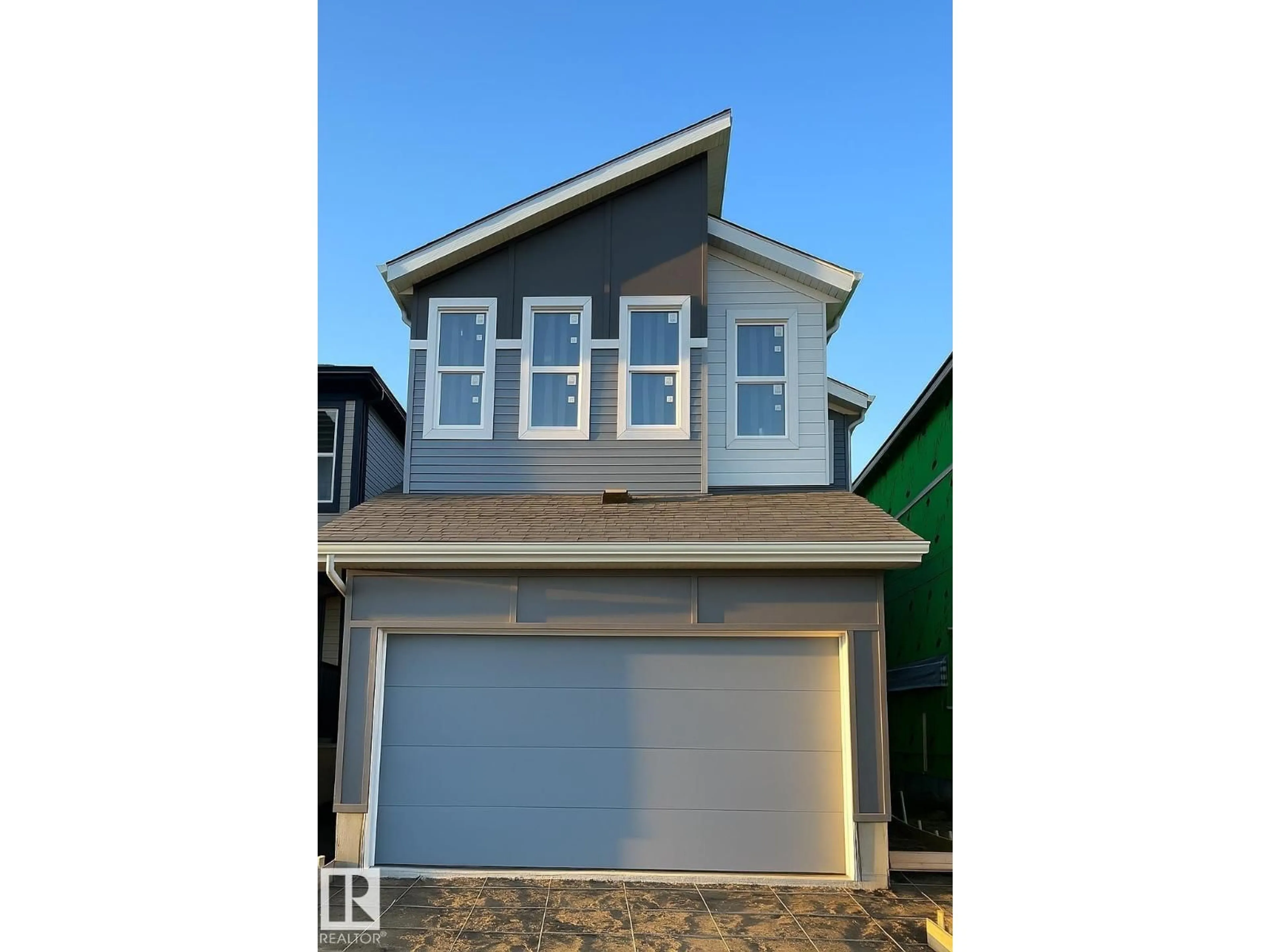 Home with vinyl exterior material, street for 2264 4 AV SW, Edmonton Alberta T0T0T0