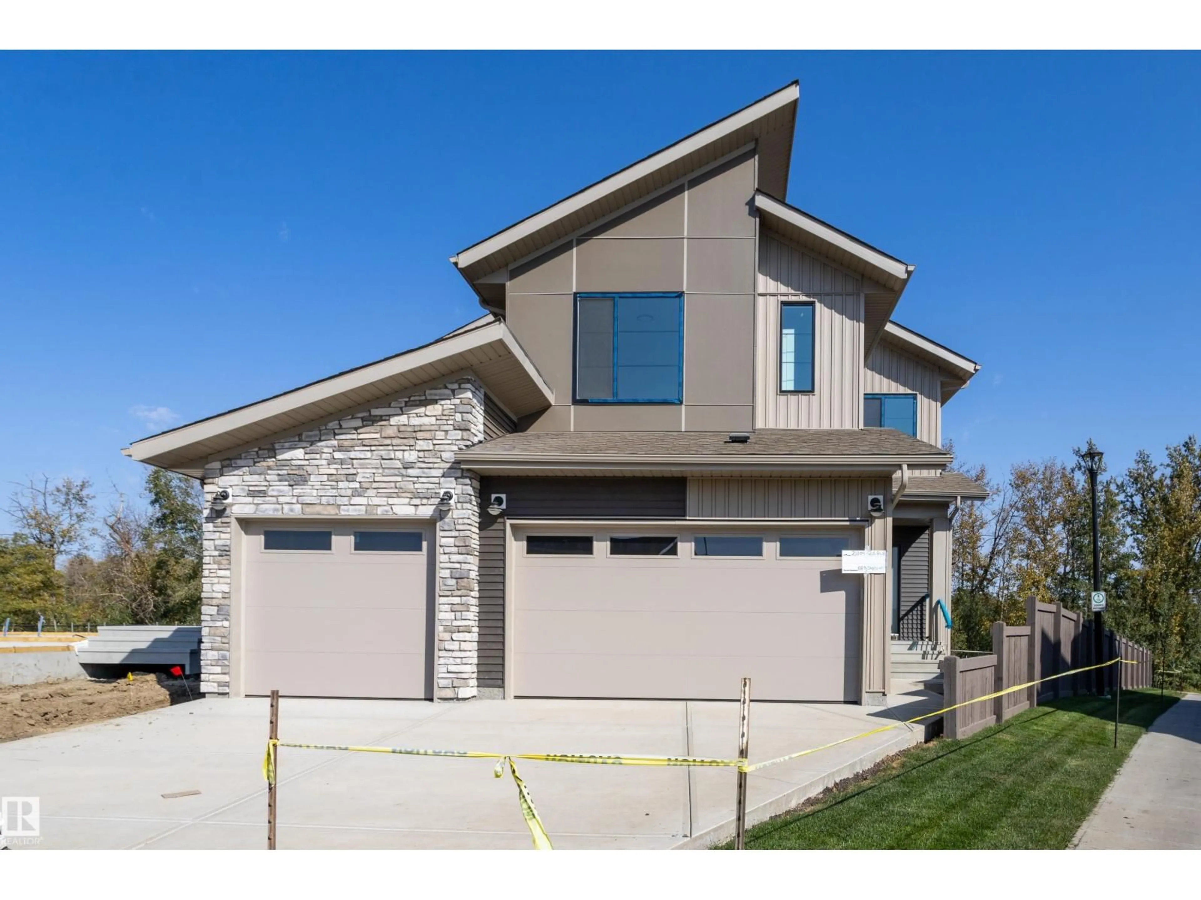 Home with brick exterior material, street for 21104 26 AV, Edmonton Alberta T6M3H2