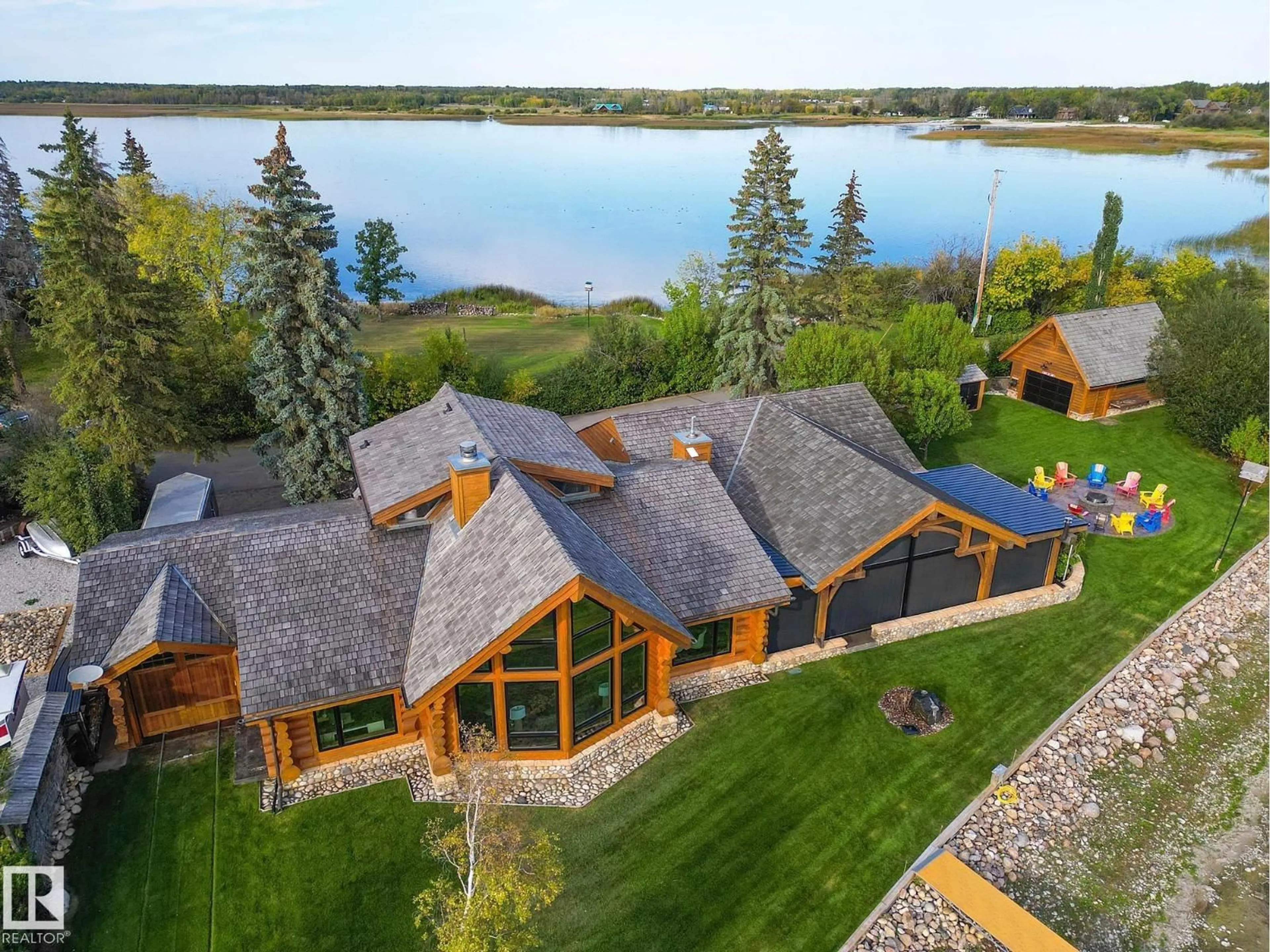 A pic from outside/outdoor area/front of a property/back of a property/a pic from drone, water/lake/river/ocean view for 1 MARTIN RD, Rural Lac Ste. Anne County Alberta T0E1A0