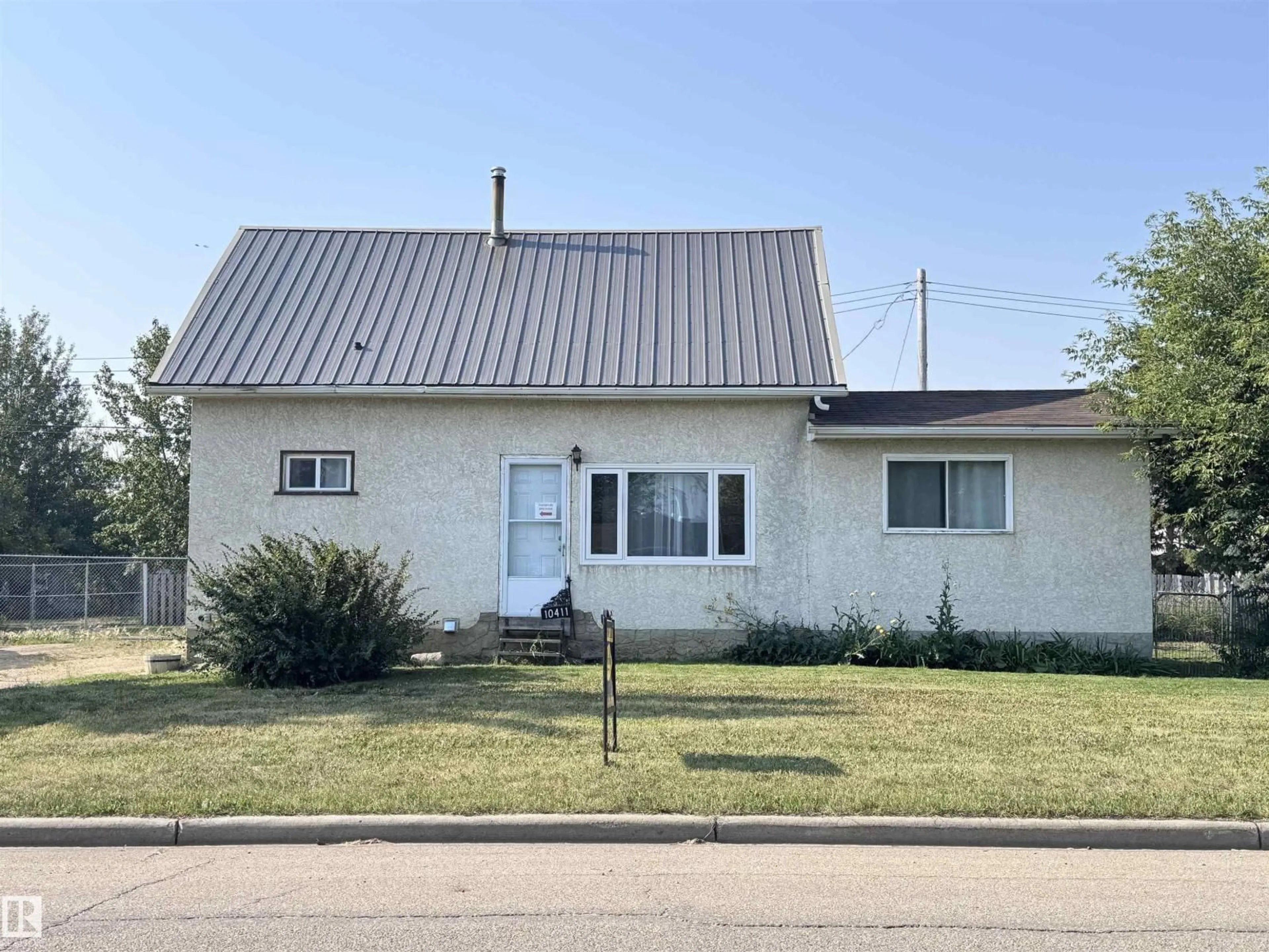 Home with vinyl exterior material, street for 10411 102 ST, Westlock Alberta T7P1K7