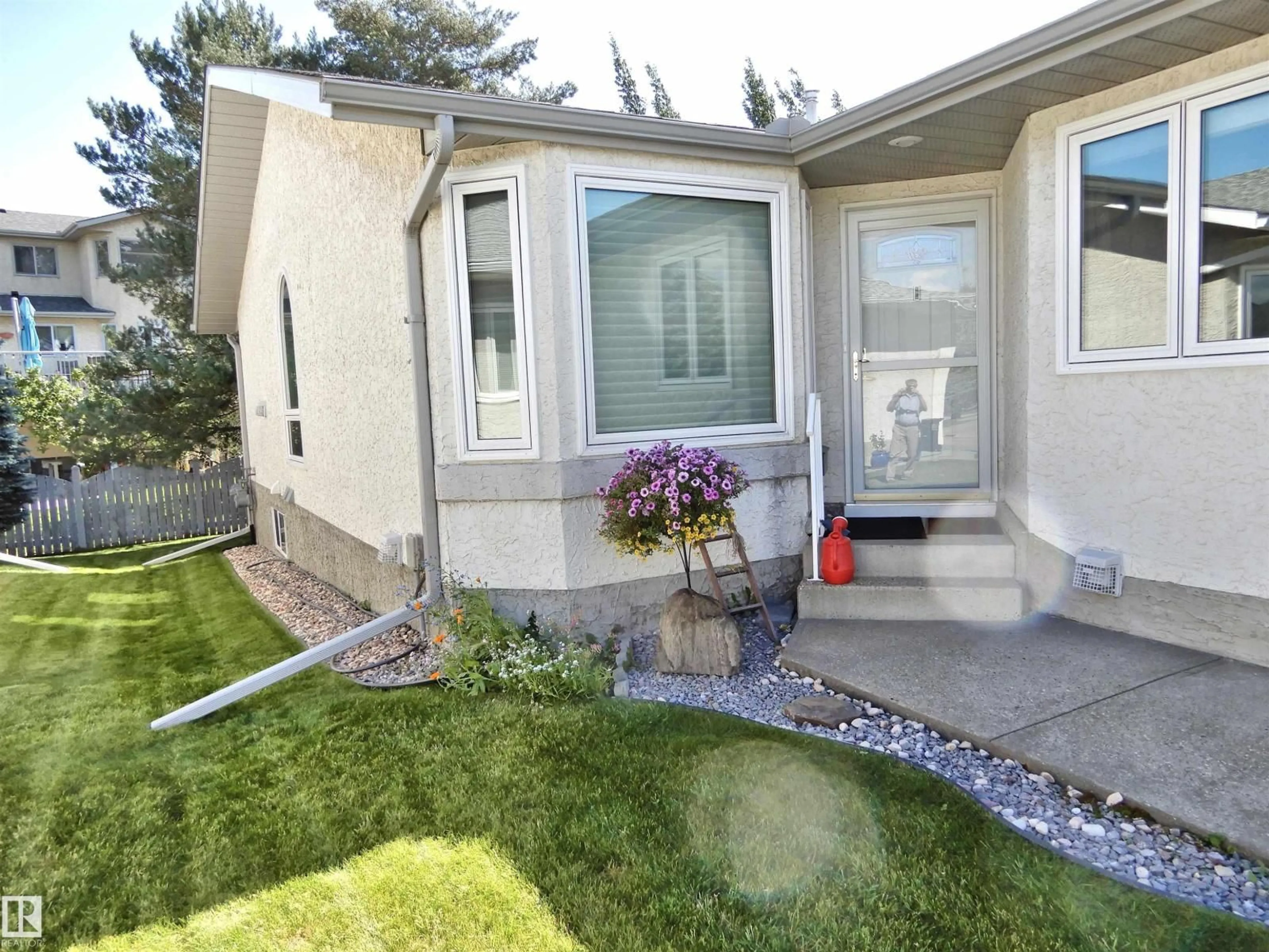 Home with vinyl exterior material, street for 6530 158 AV, Edmonton Alberta T5Y2S7