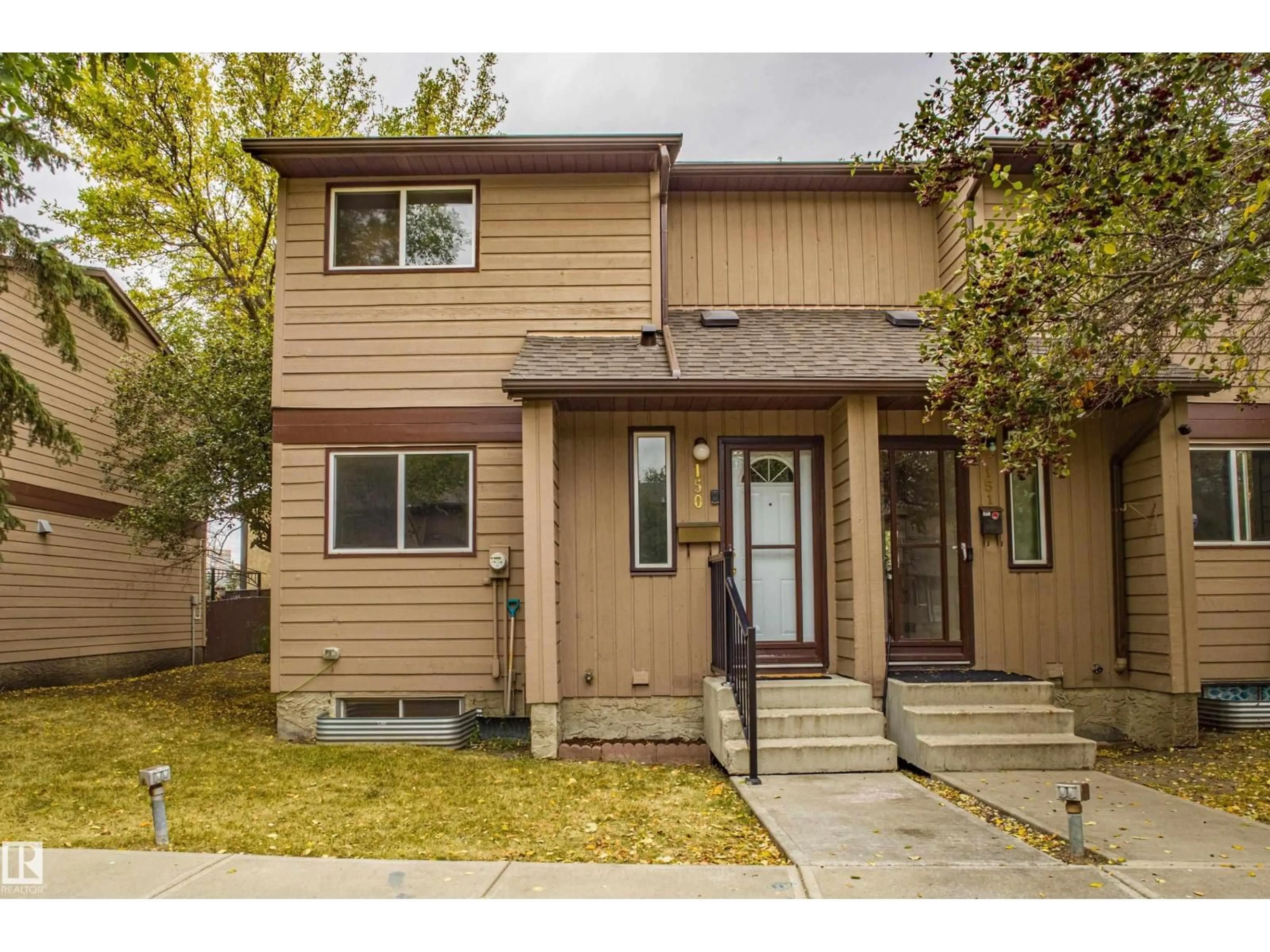 Home with vinyl exterior material, street for 150 10633 31 AV NW, Edmonton Alberta T6J4N4