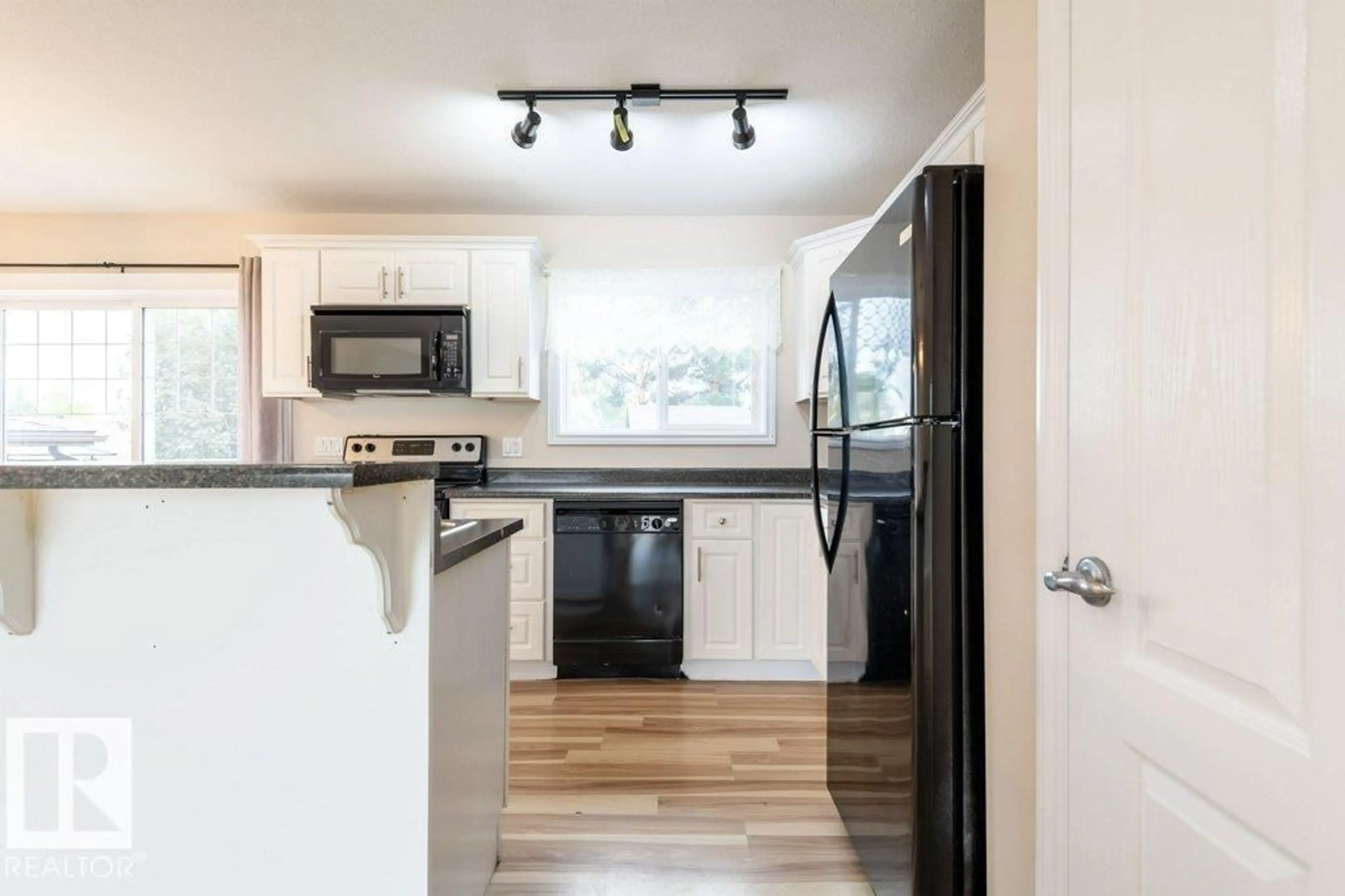 Open concept kitchen, wood/laminate floor for 4617 54 AV, Bruderheim Alberta T0B0S0
