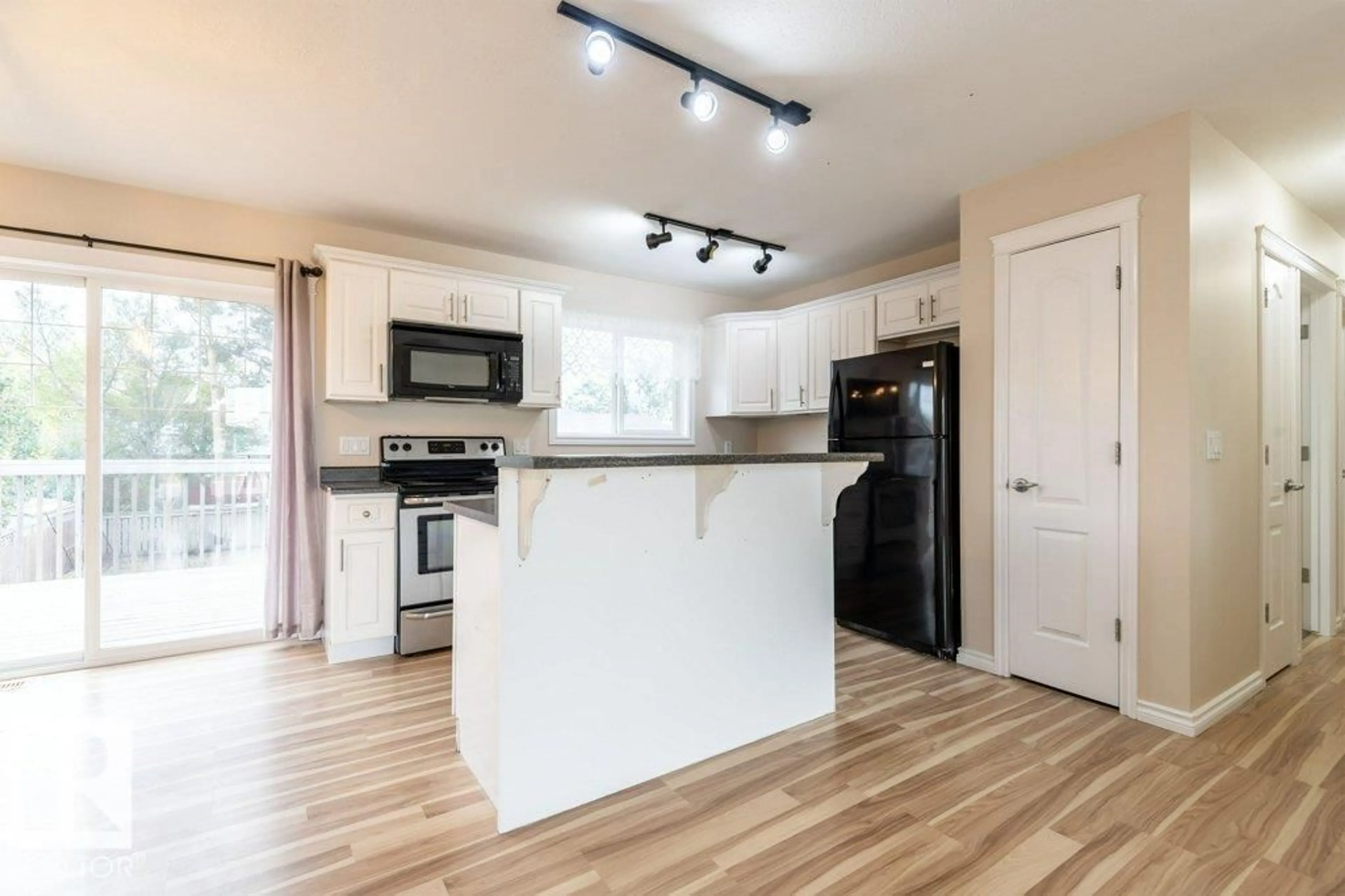 Open concept kitchen, wood/laminate floor for 4617 54 AV, Bruderheim Alberta T0B0S0