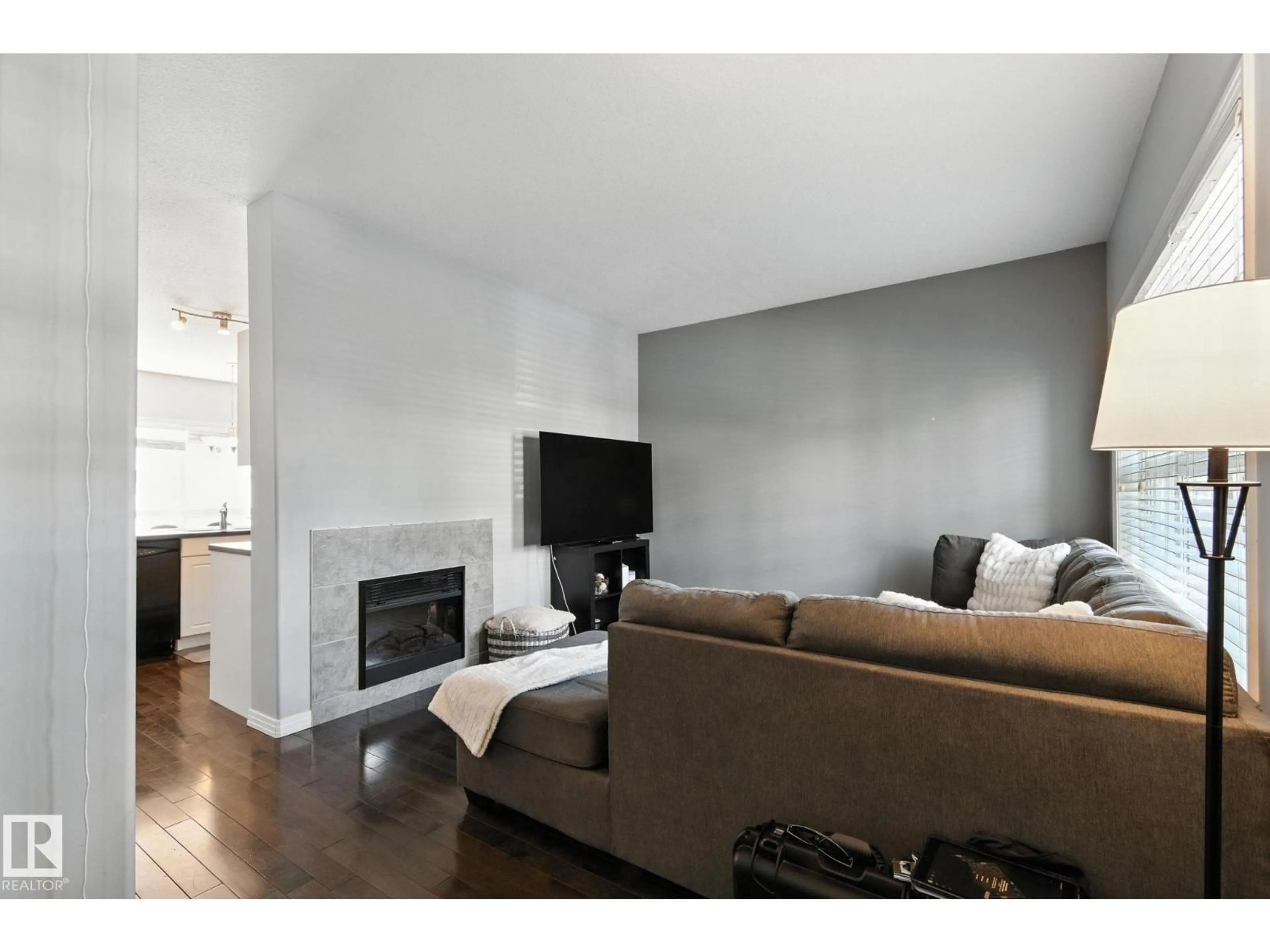 Living room with furniture, wood/laminate floor for 4481 MCCRAE AV, Edmonton Alberta T5E4G6