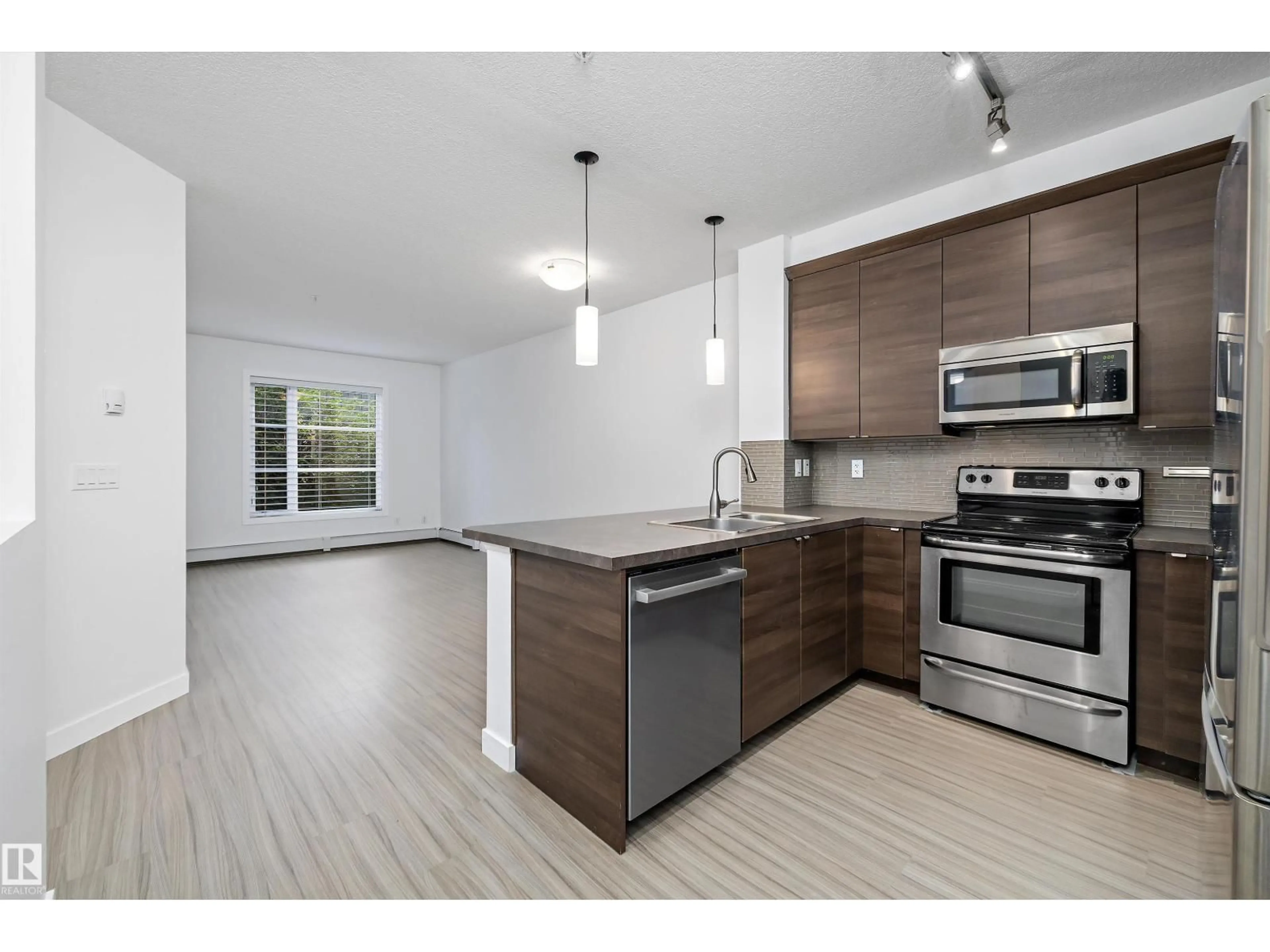 Open concept kitchen, unknown for #108 - 2590 ANDERSON WY, Edmonton Alberta T6W0R2