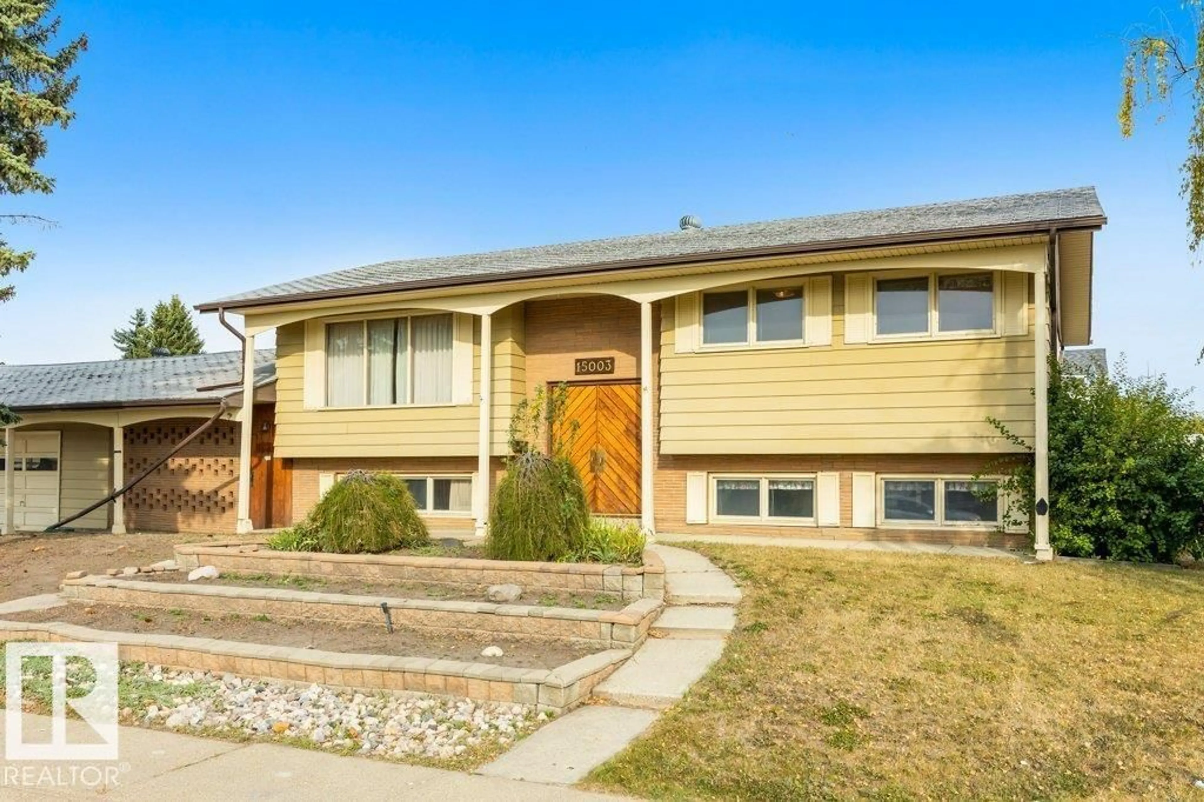 Home with vinyl exterior material, street for 15003 88 ST, Edmonton Alberta T5E5F9