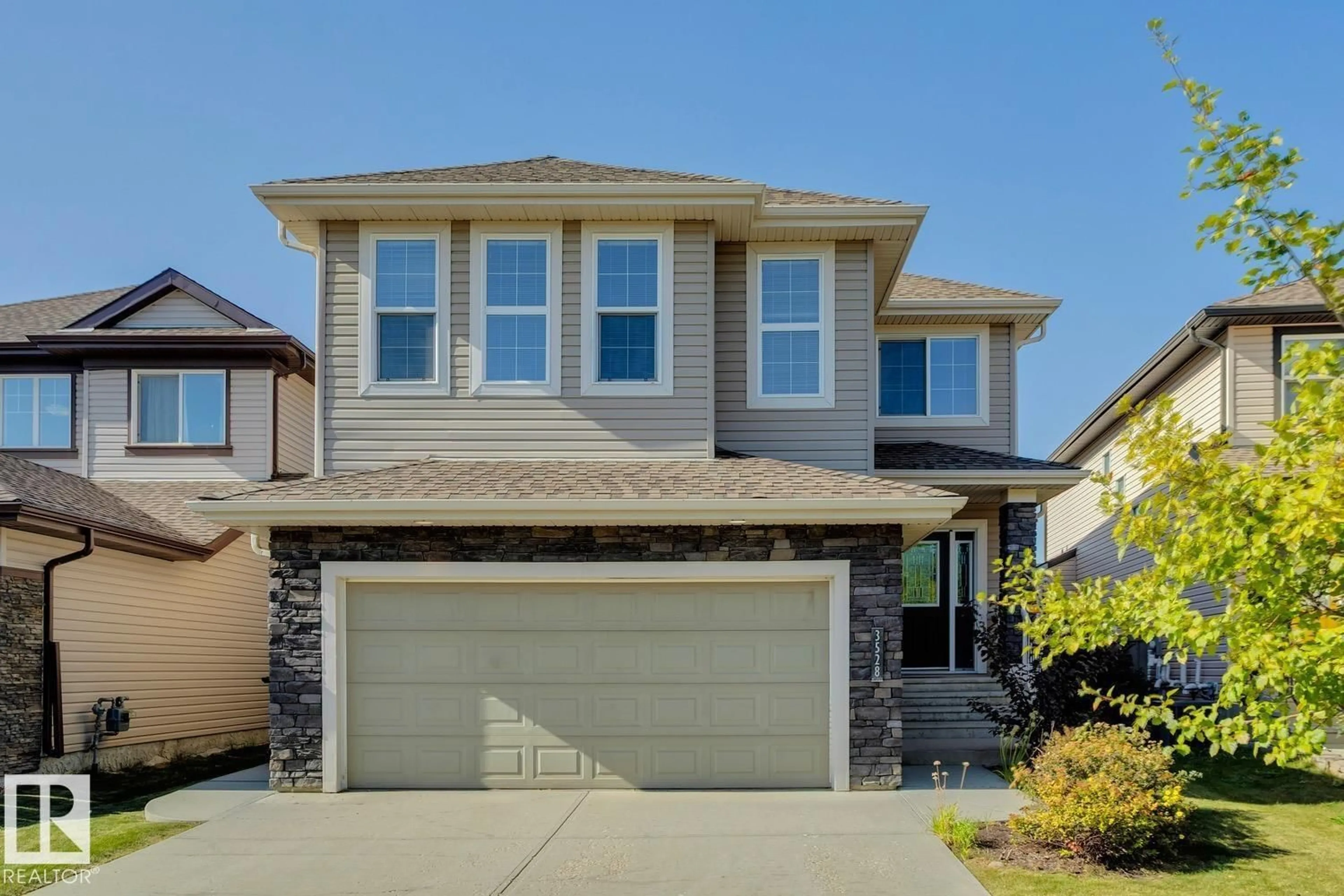 Home with vinyl exterior material, street for 3528 CLAXTON CR, Edmonton Alberta T6W0Z6