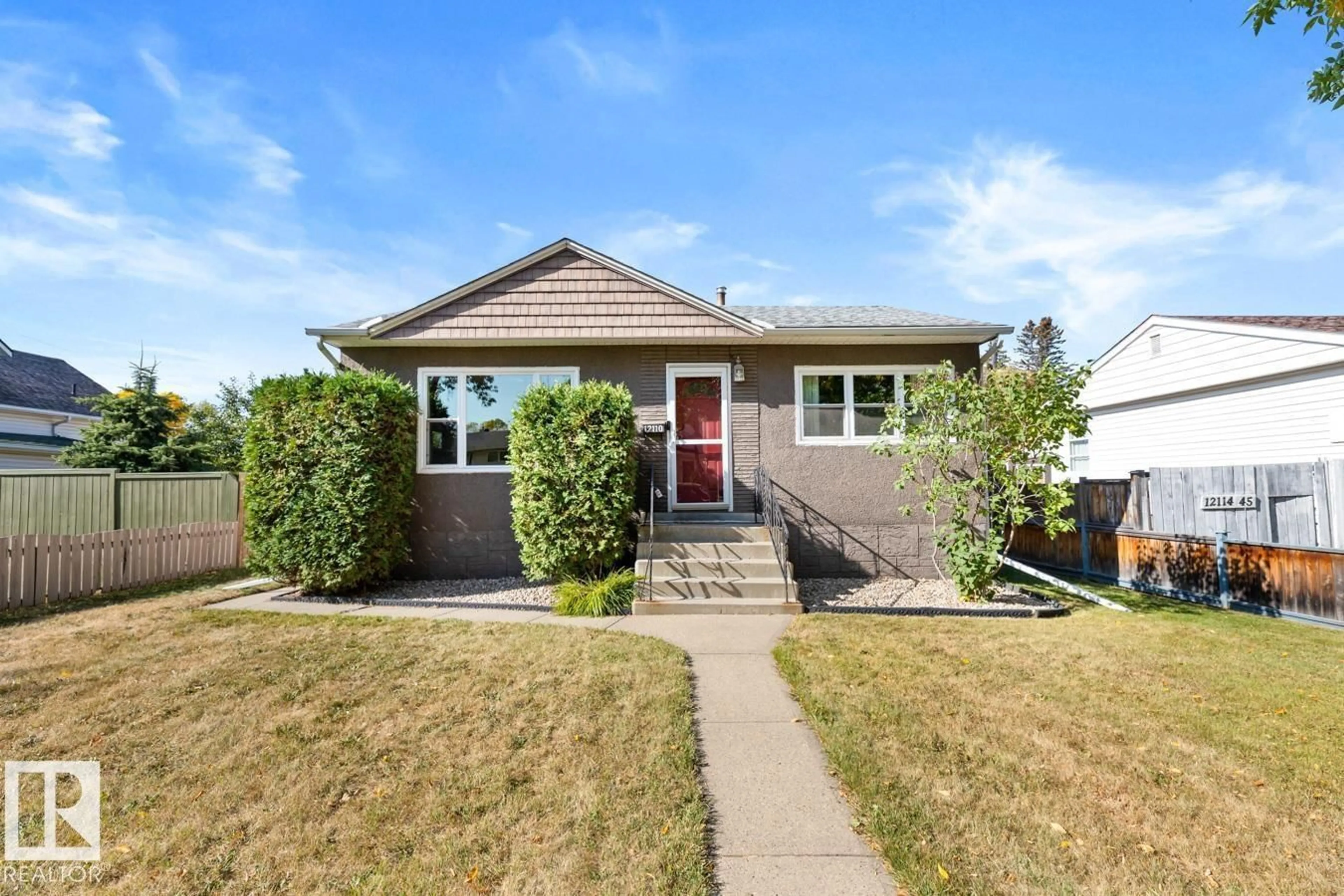 Home with vinyl exterior material, street for NW - 12110 45 ST, Edmonton Alberta T5W2V1