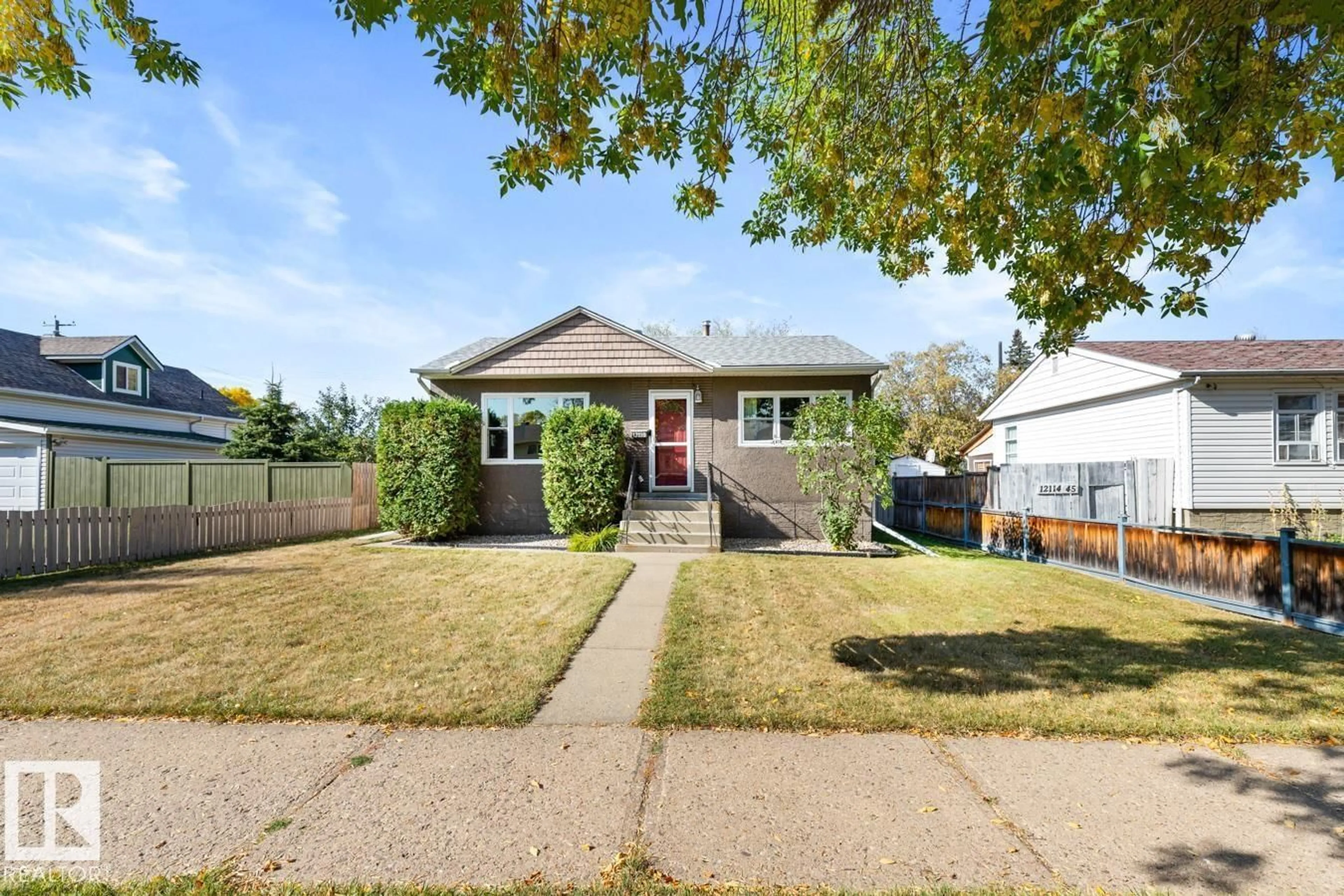Home with vinyl exterior material, street for NW - 12110 45 ST, Edmonton Alberta T5W2V1