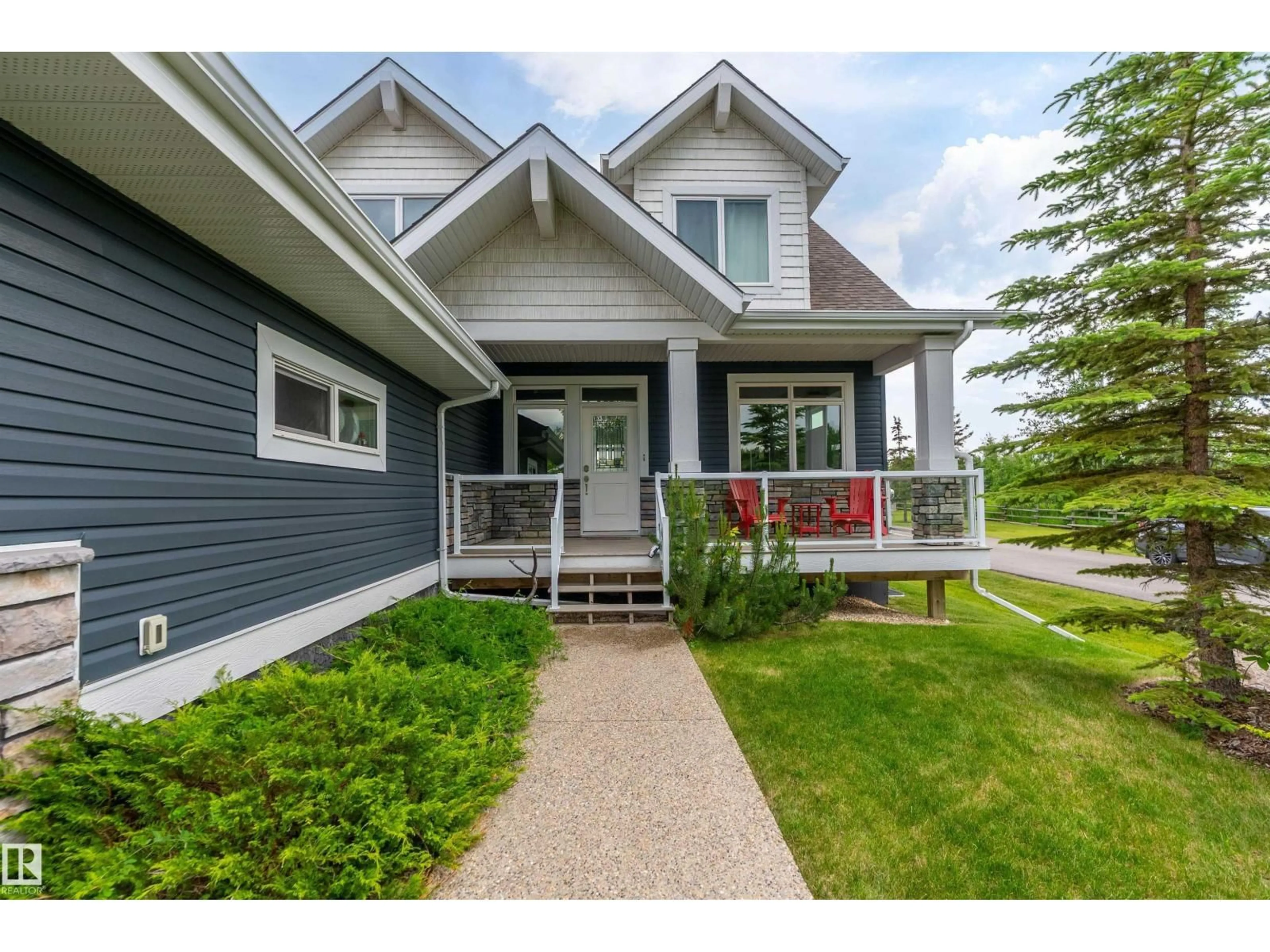 Home with vinyl exterior material, street for 55101 - 547 STE. ANNE TR, Rural Lac Ste. Anne County Alberta T0E1A1