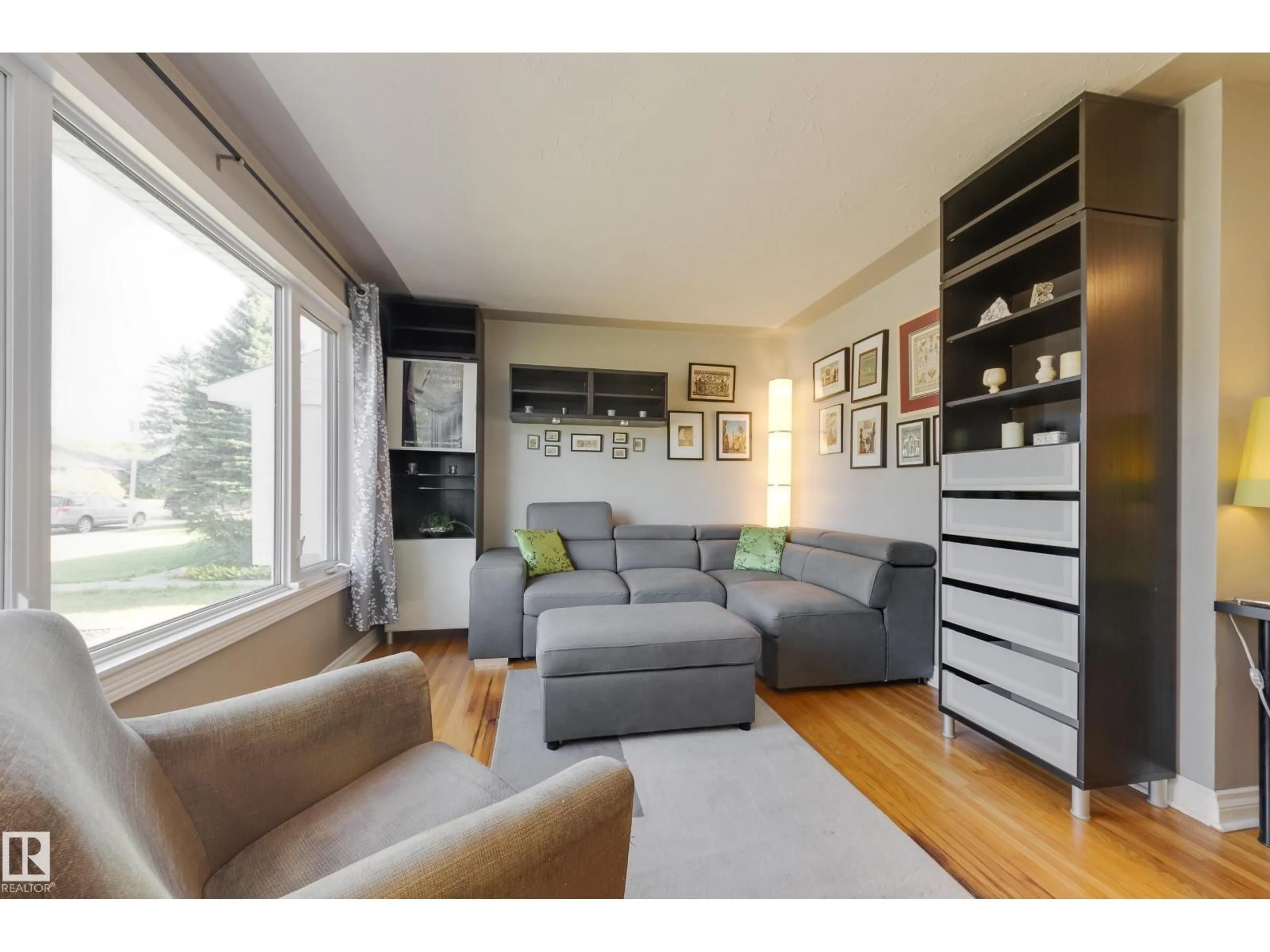 Living room with furniture, wood/laminate floor for 13039 128A AV, Edmonton Alberta T5L3H8