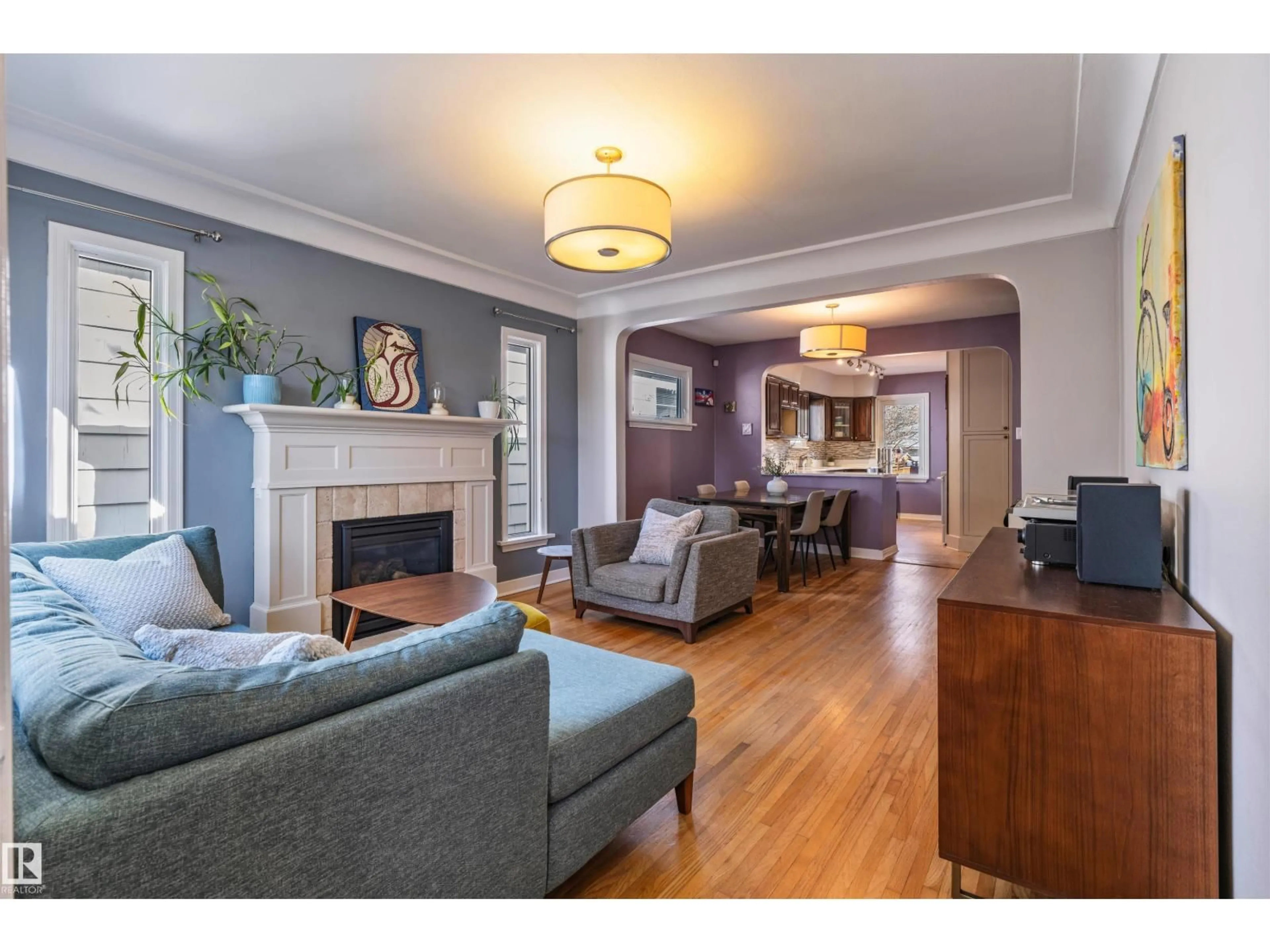 Living room with furniture, wood/laminate floor for NW - 9756 88 AV, Edmonton Alberta T6E2P9