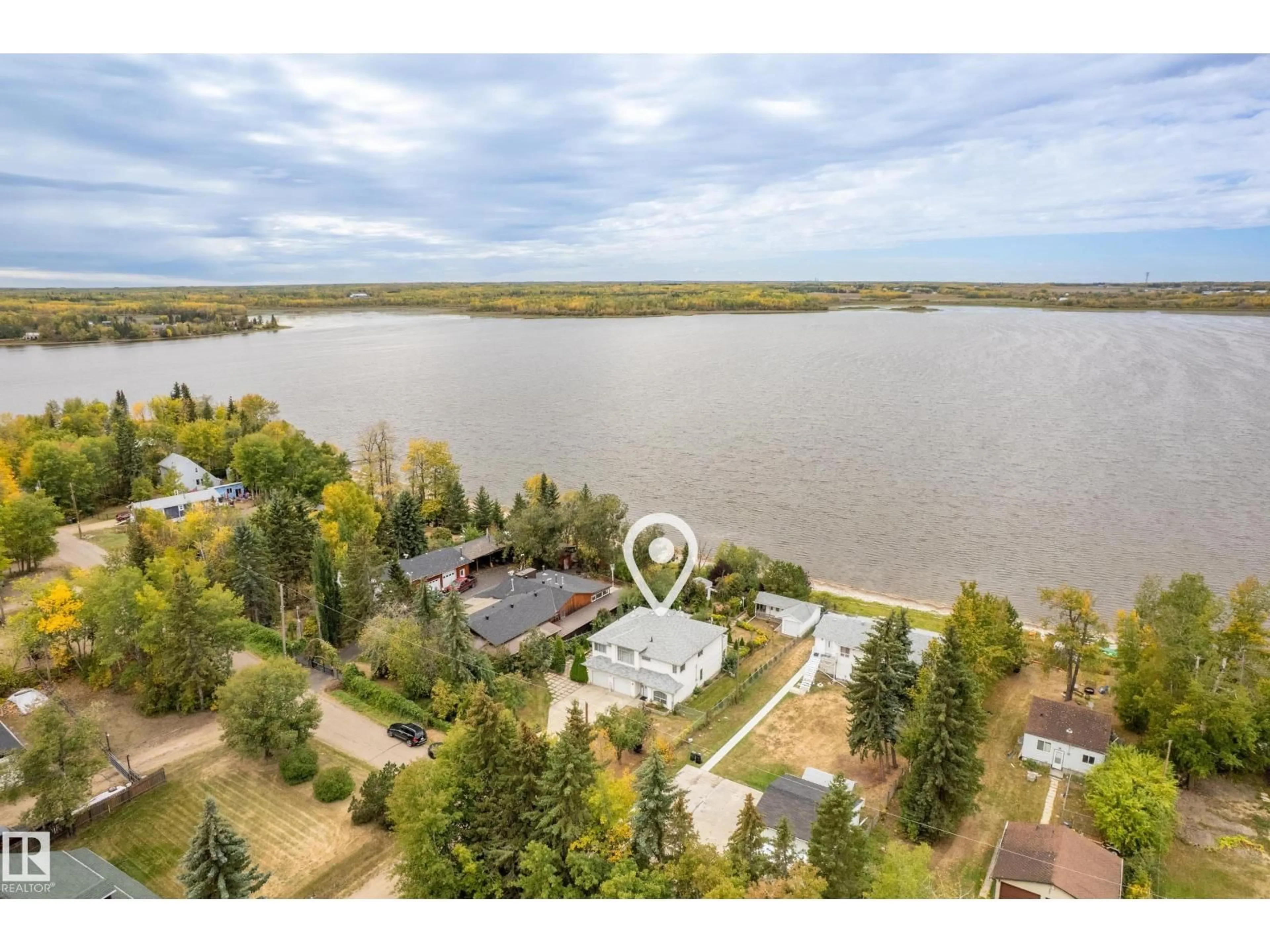 A pic from outside/outdoor area/front of a property/back of a property/a pic from drone, water/lake/river/ocean view for 76 - 52343 RGE ROAD 211, Rural Strathcona County Alberta T8G1A6