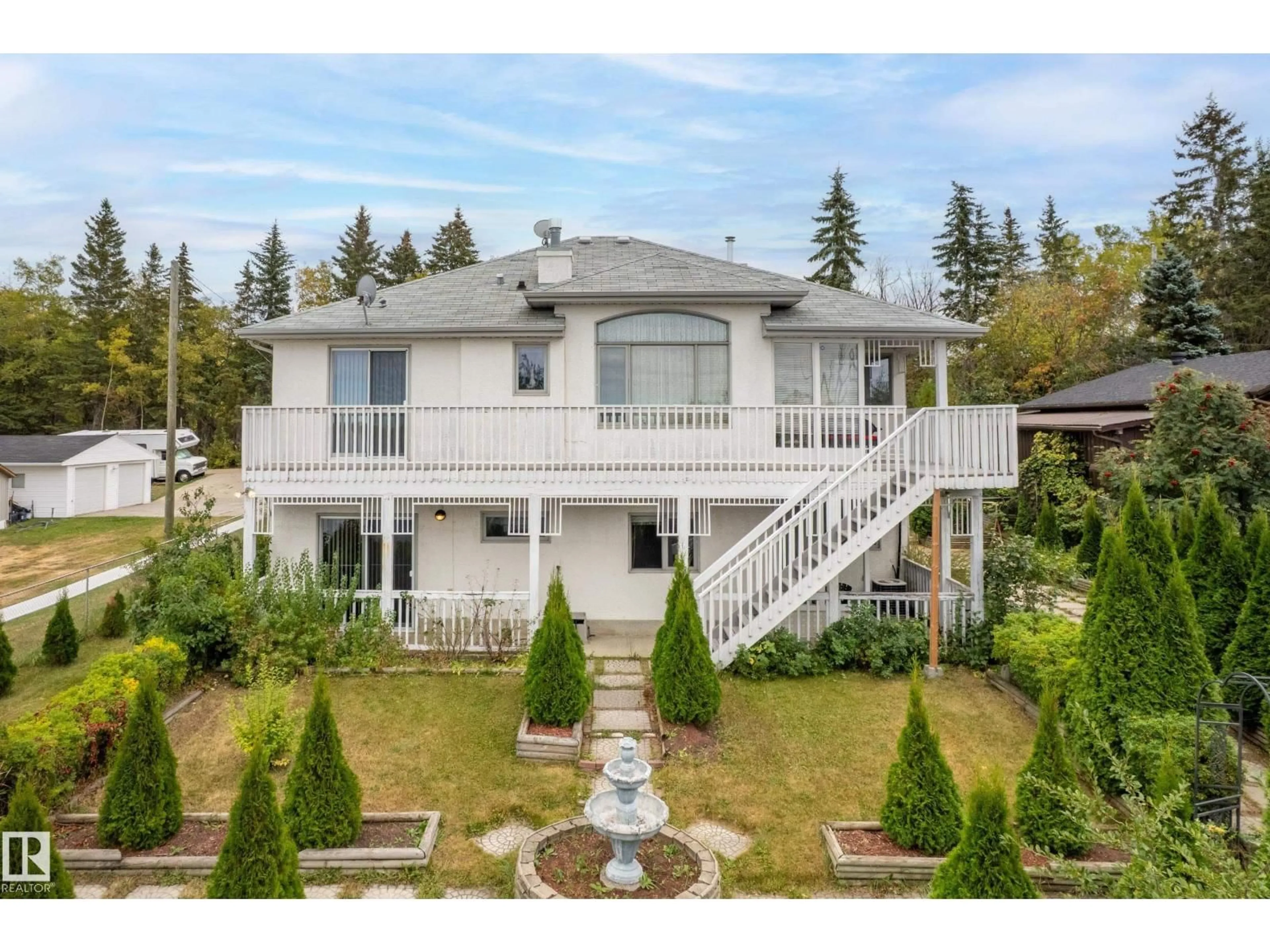 A pic from outside/outdoor area/front of a property/back of a property/a pic from drone, street for 76 - 52343 RGE ROAD 211, Rural Strathcona County Alberta T8G1A6
