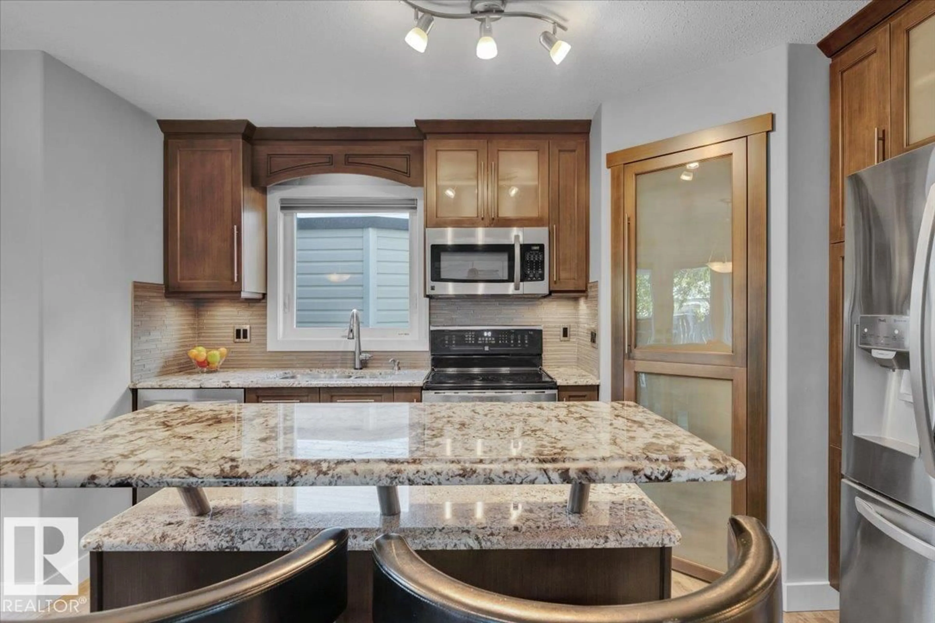 Open concept kitchen, ceramic/tile floor for 1808 37 AV, Edmonton Alberta T6T1S6