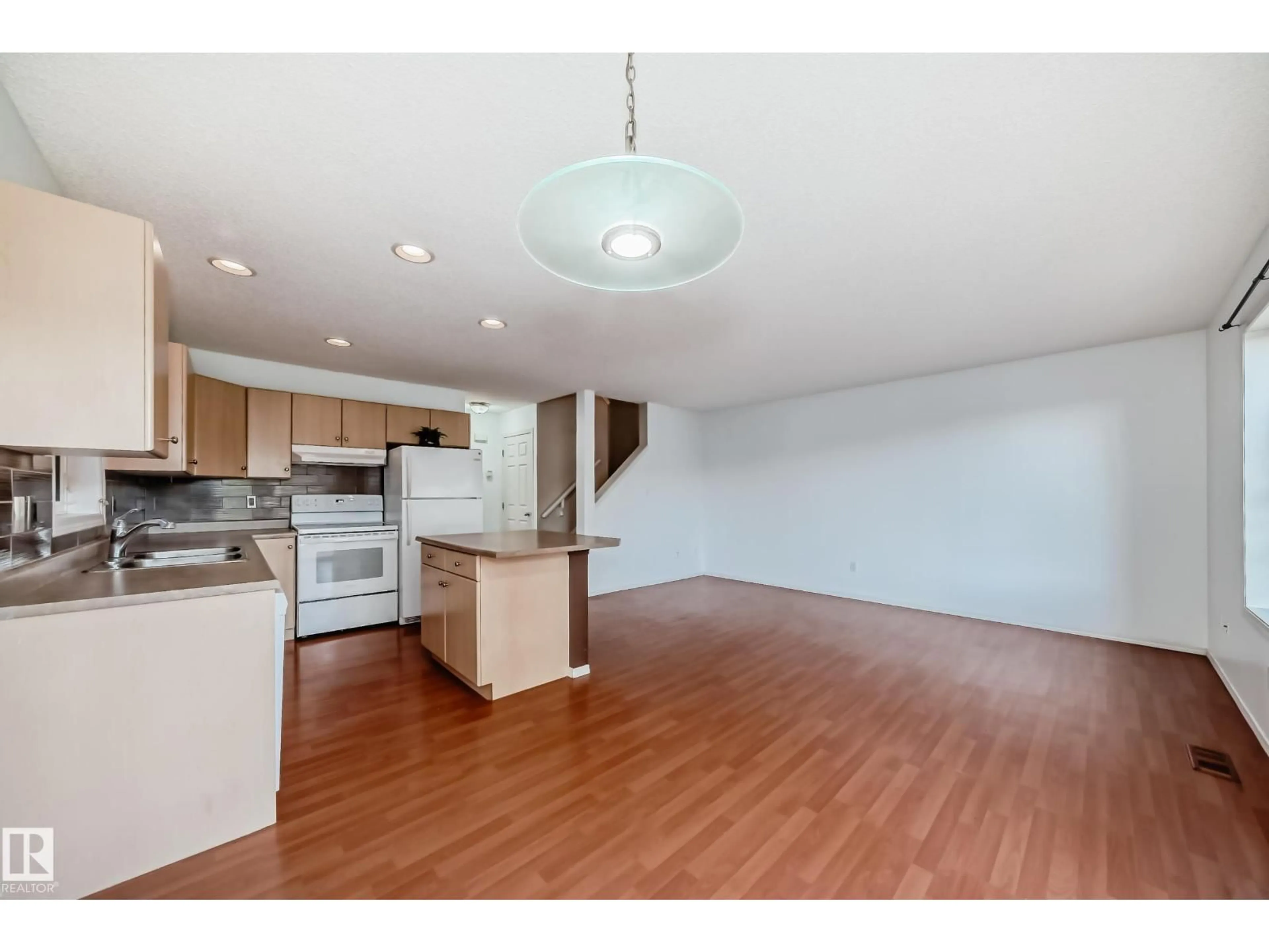 Open concept kitchen, wood/laminate floor for #34 - 2021 GRANTHAM CT, Edmonton Alberta T5T6V7