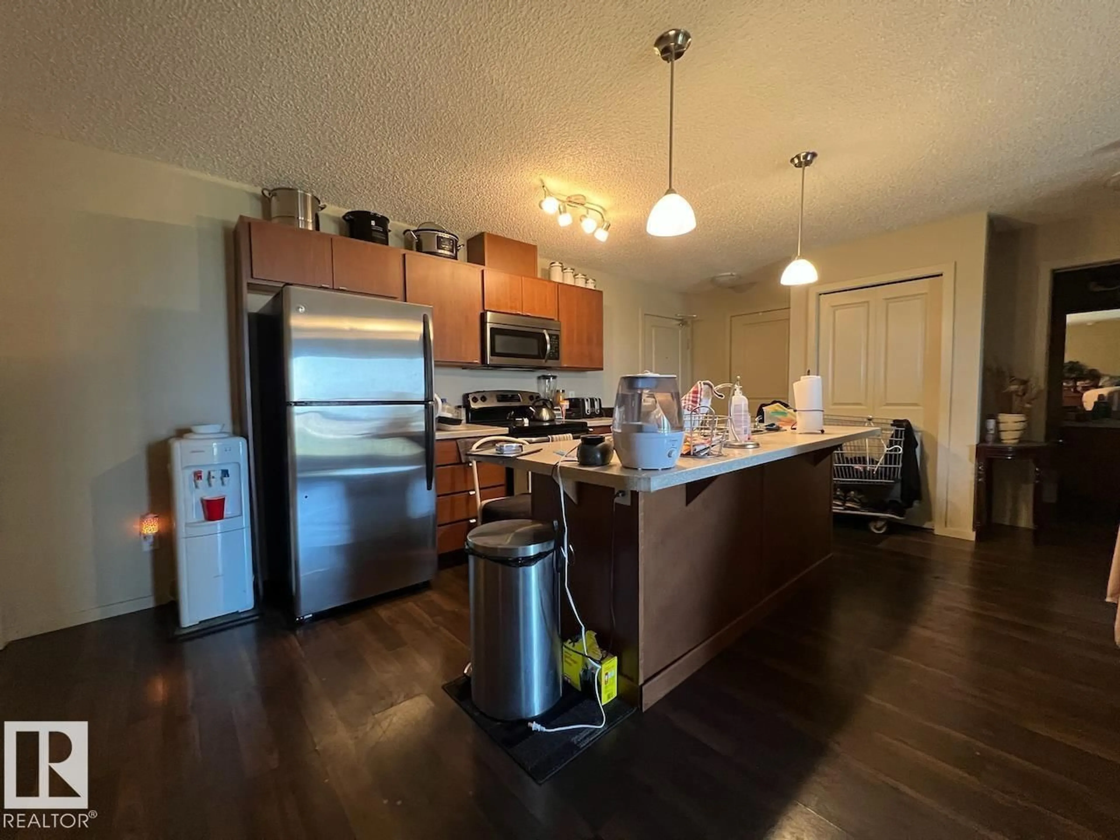 Open concept kitchen, wood/laminate floor for 1196 - 459 HYNDMAN RD, Edmonton Alberta T5A0X8