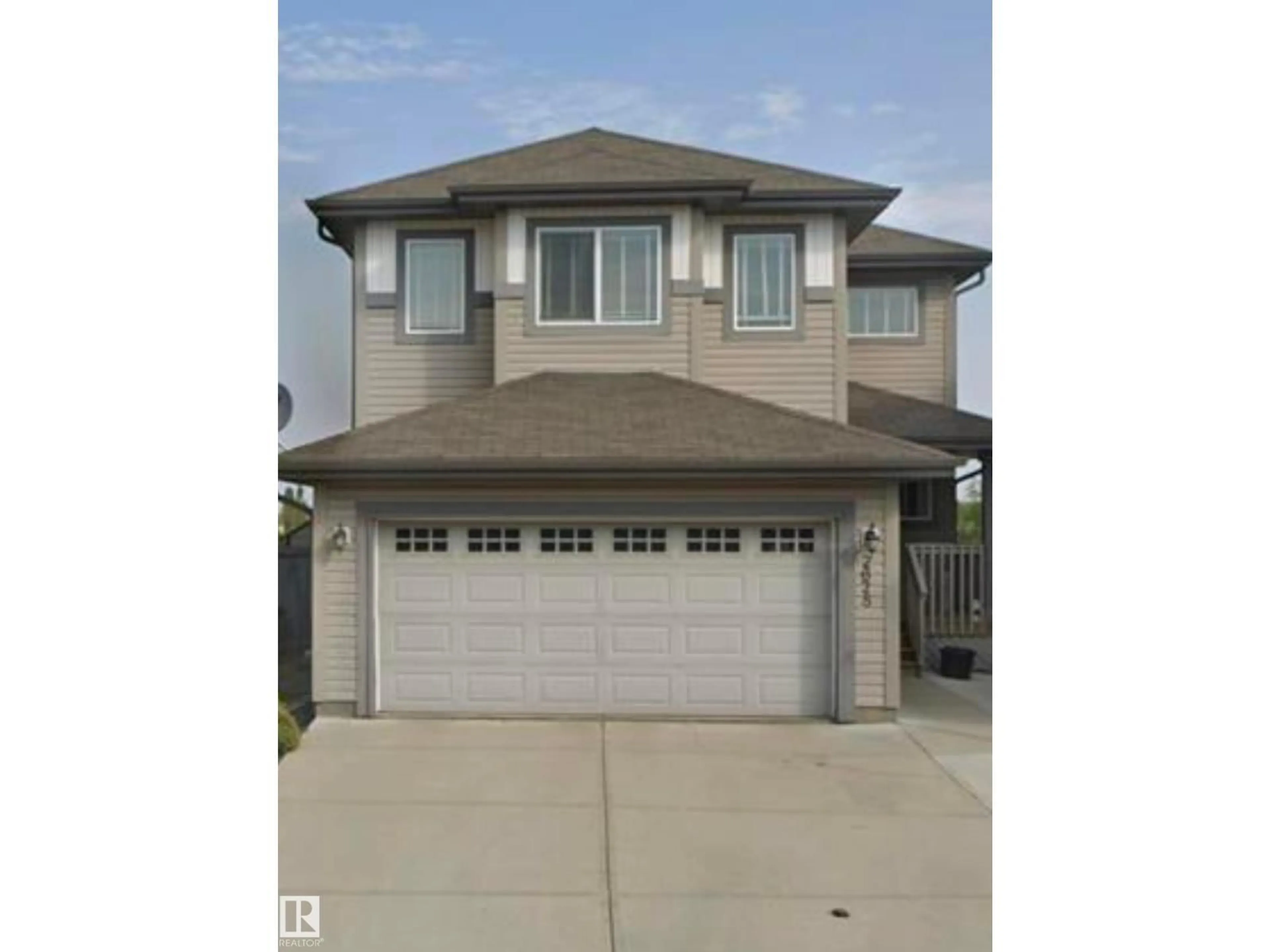 Home with vinyl exterior material, street for 2628 30 ST, Edmonton Alberta T6T0H6