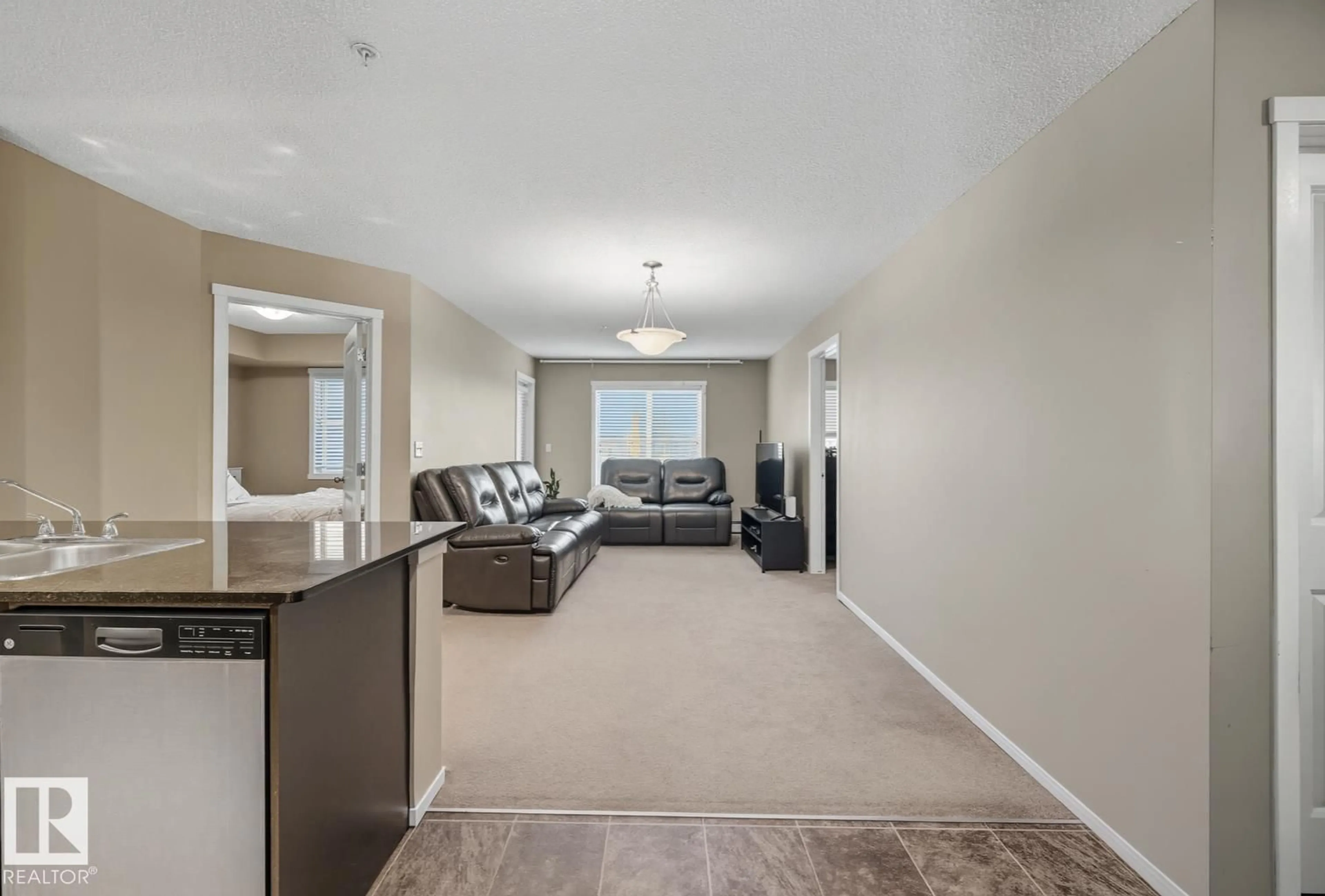 Living room with furniture, unknown for #205 - 5810 MULLEN PL, Edmonton Alberta T6R0W3