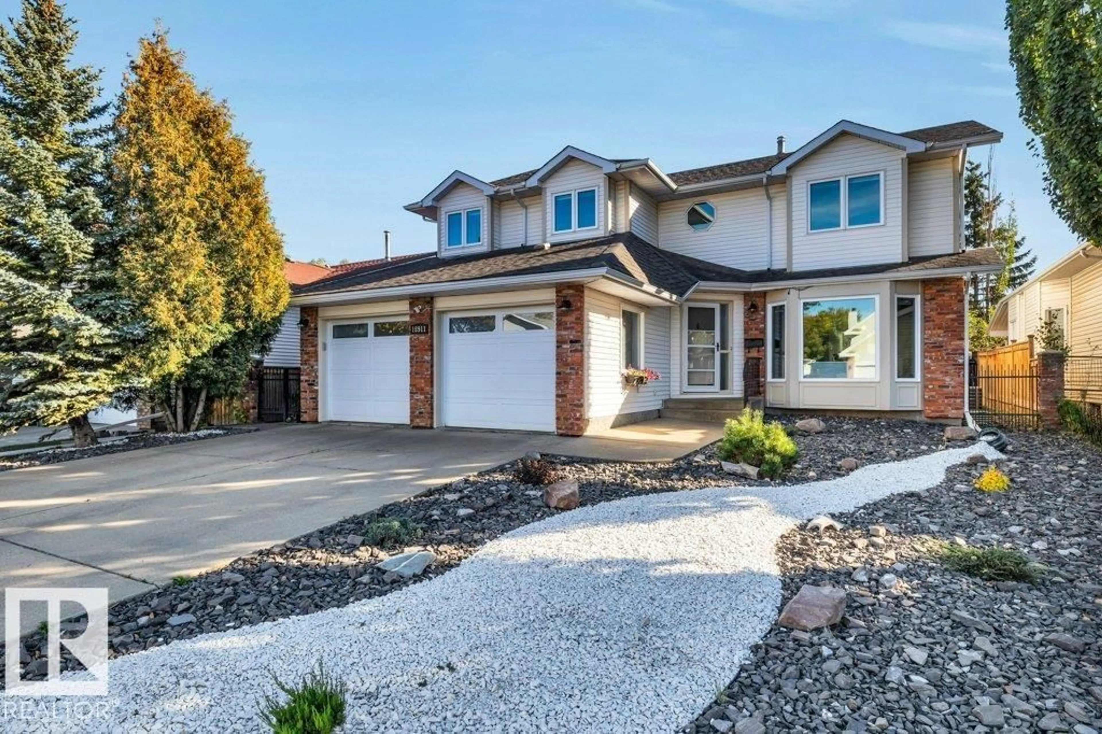 Home with brick exterior material, street for 18911 94 AV NW, Edmonton Alberta T5T4X5