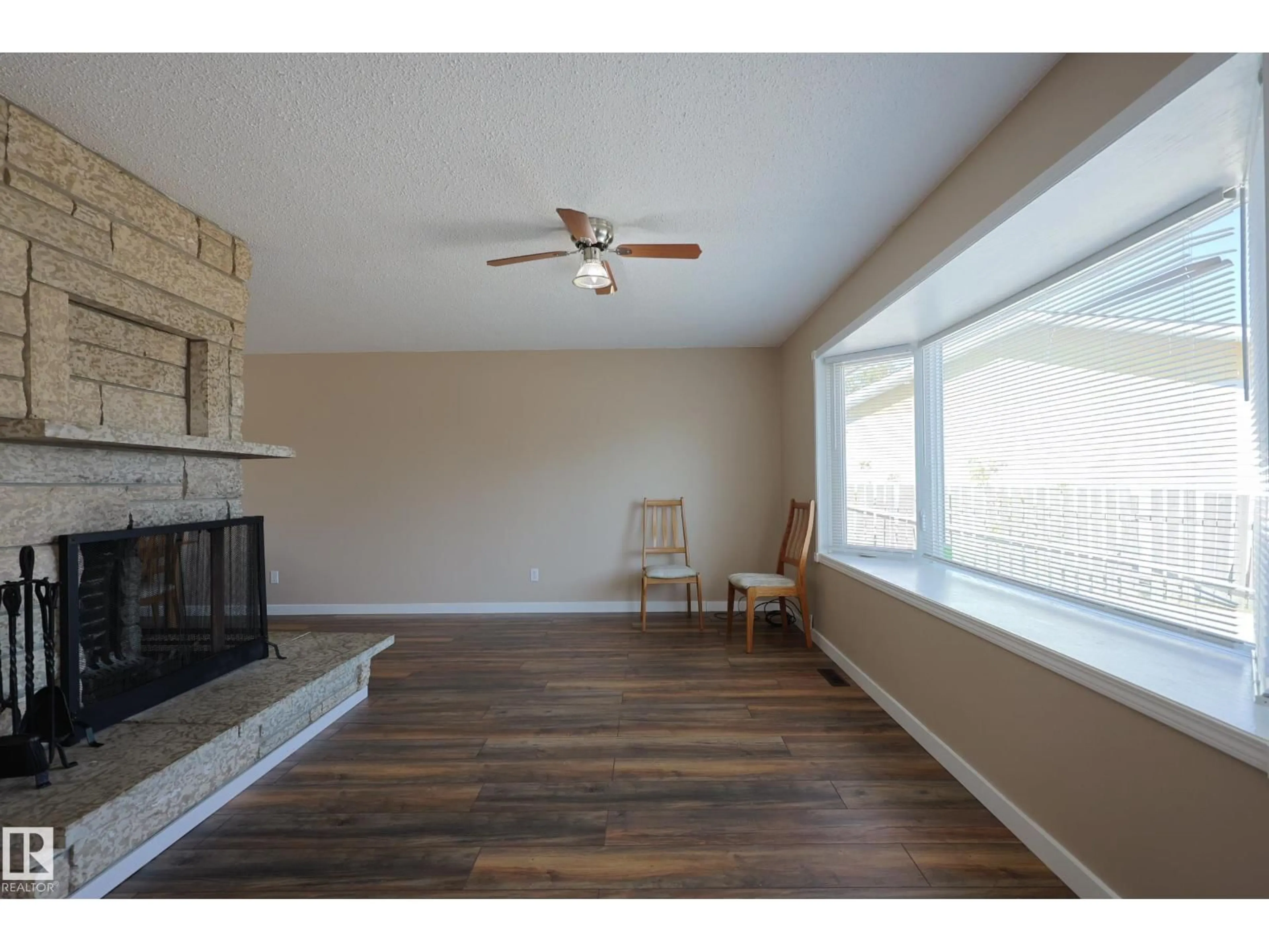 Living room with furniture, wood/laminate floor for 5324 49 AV, Onoway Alberta T0E1V0