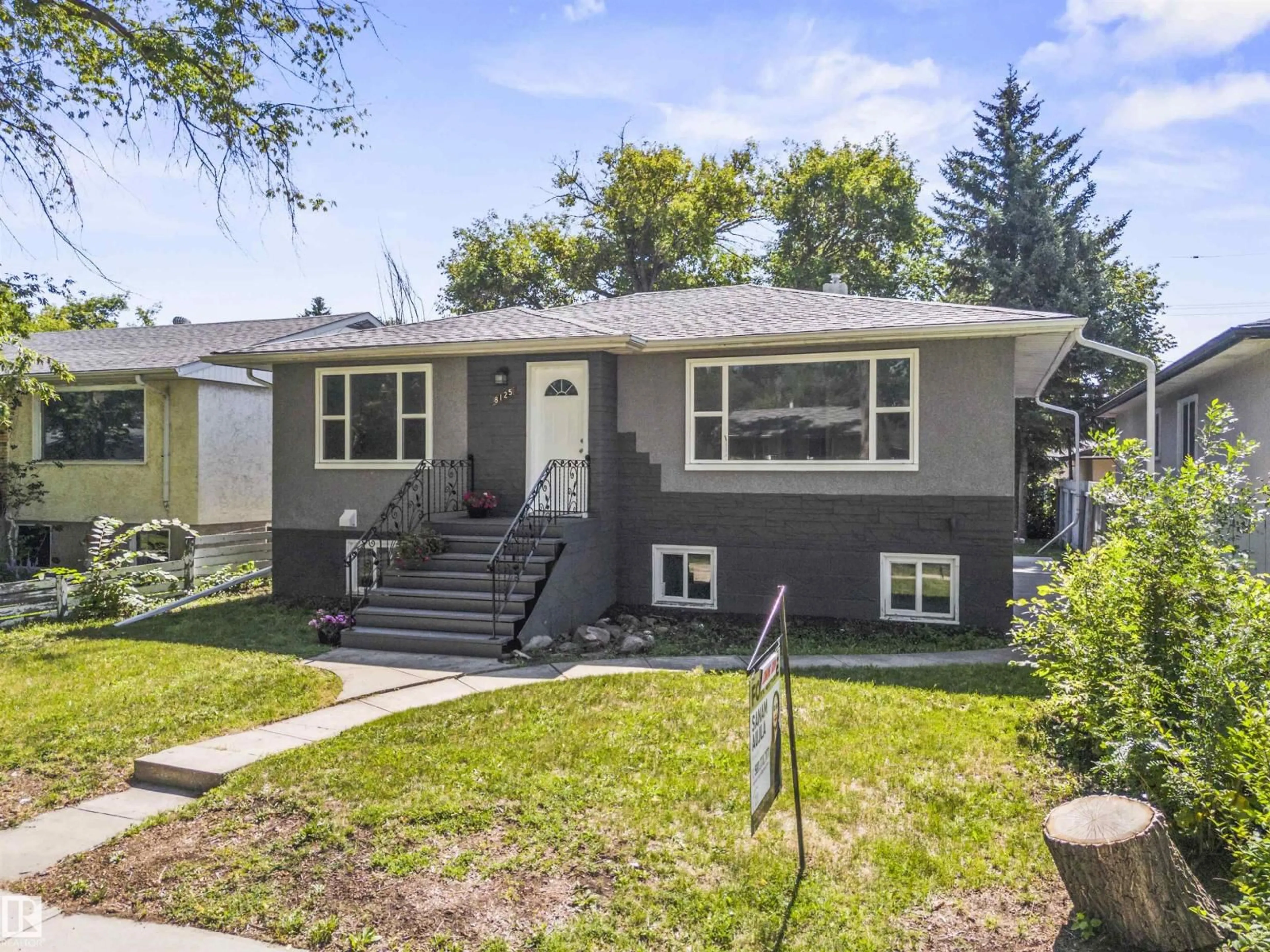 Home with vinyl exterior material, street for 8125 84 AV, Edmonton Alberta T6C1C7