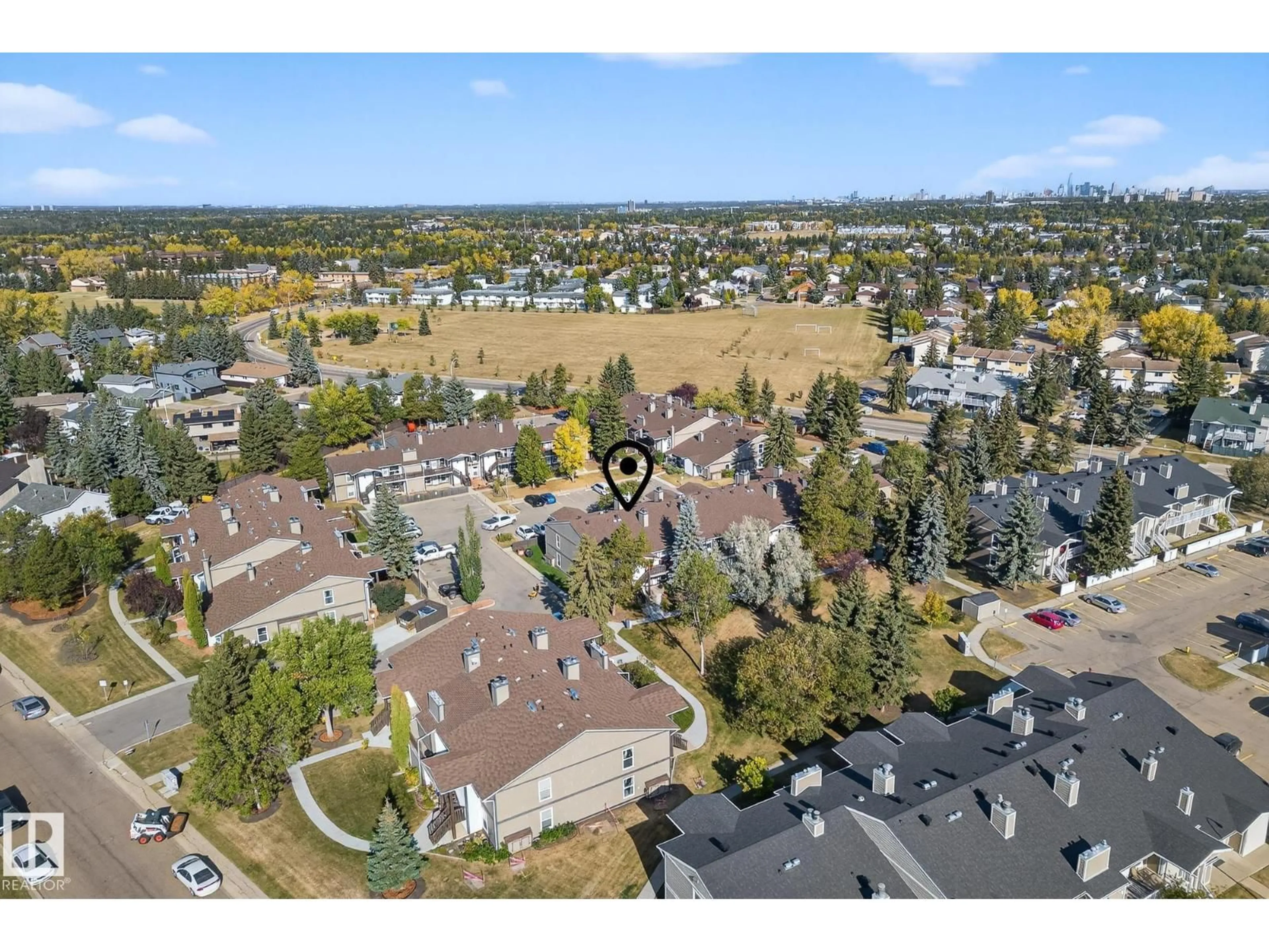 A pic from outside/outdoor area/front of a property/back of a property/a pic from drone, mountain view for 1174 SADDLEBACK RD, Edmonton Alberta T6J4Z4