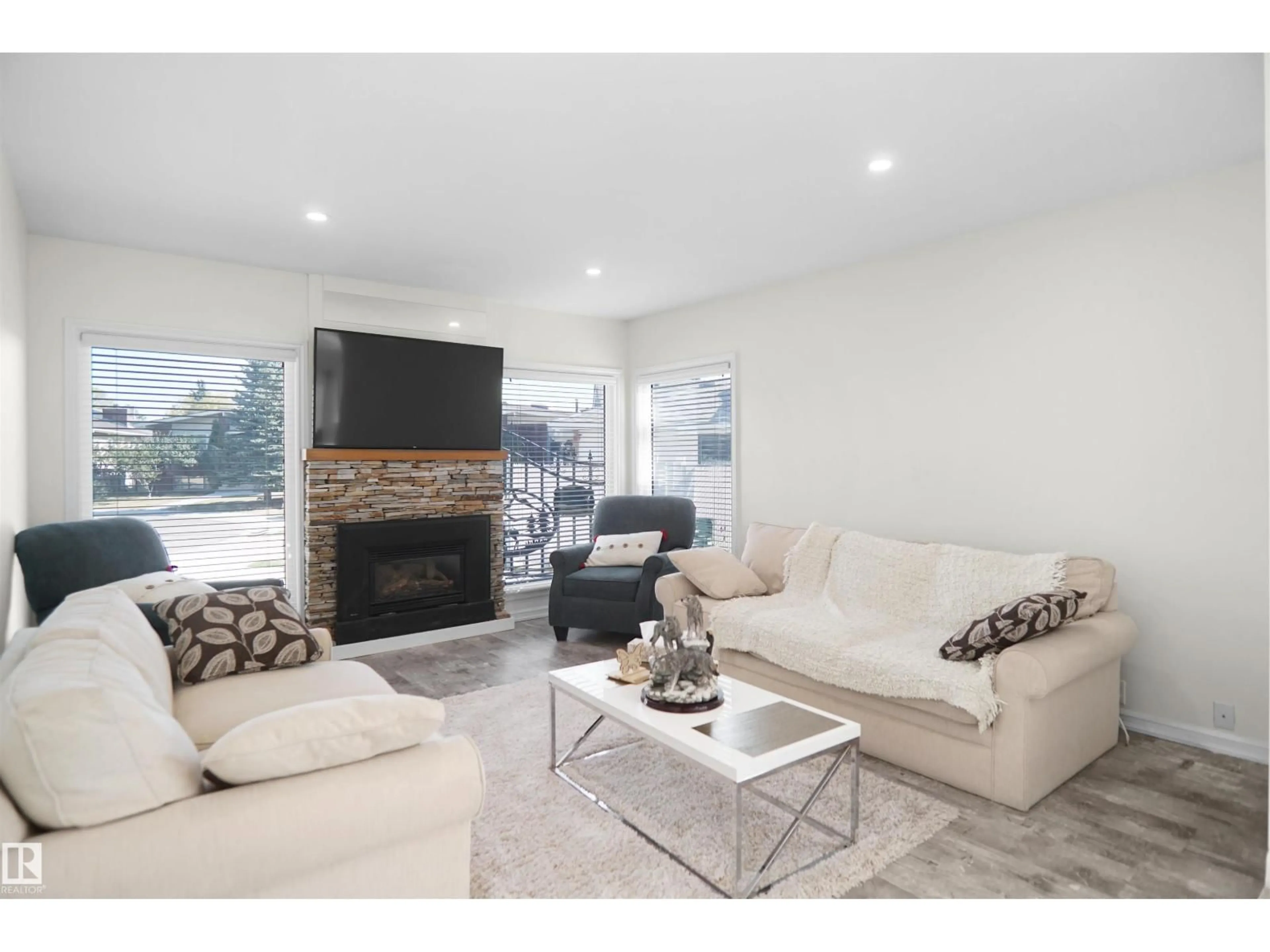 Living room with furniture, wood/laminate floor for 16008 101 ST NW, Edmonton Alberta T5X5B4