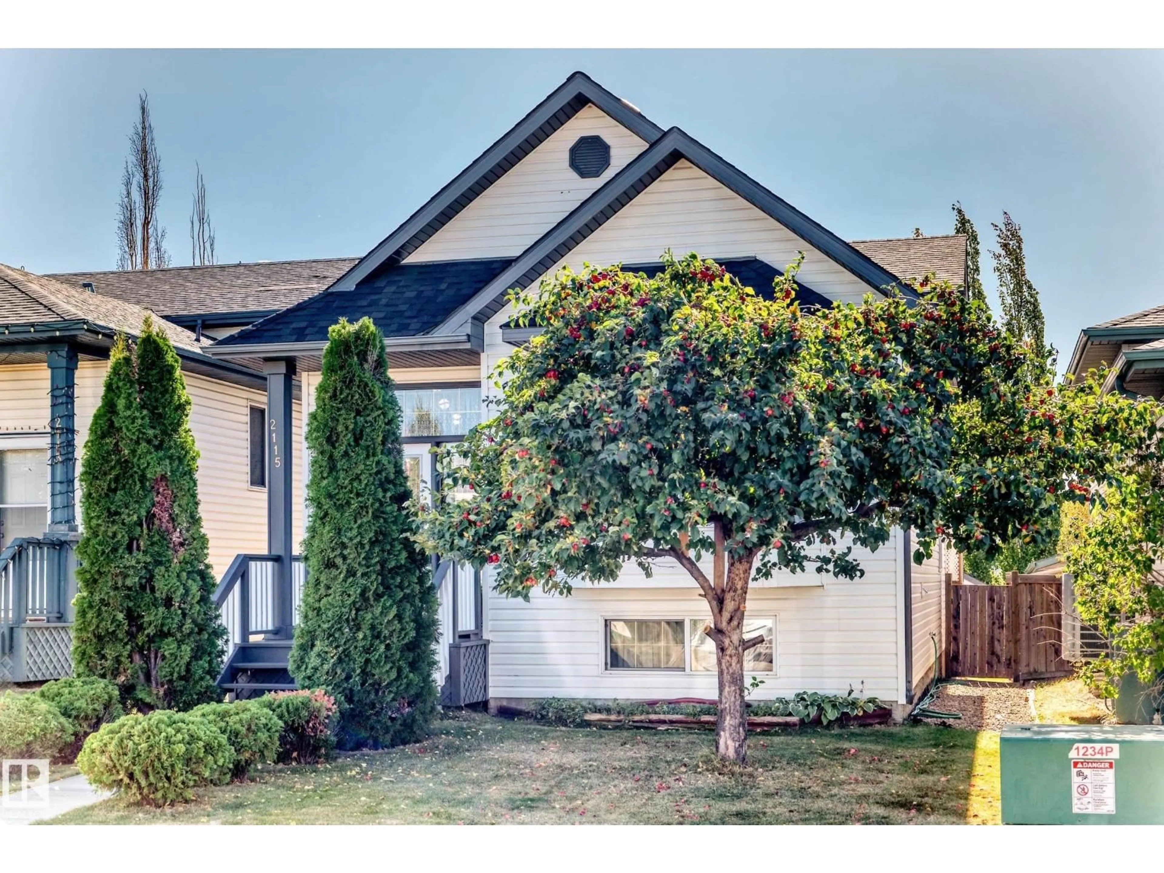 Home with vinyl exterior material, street for 2115 36 AV, Edmonton Alberta T6T1S3
