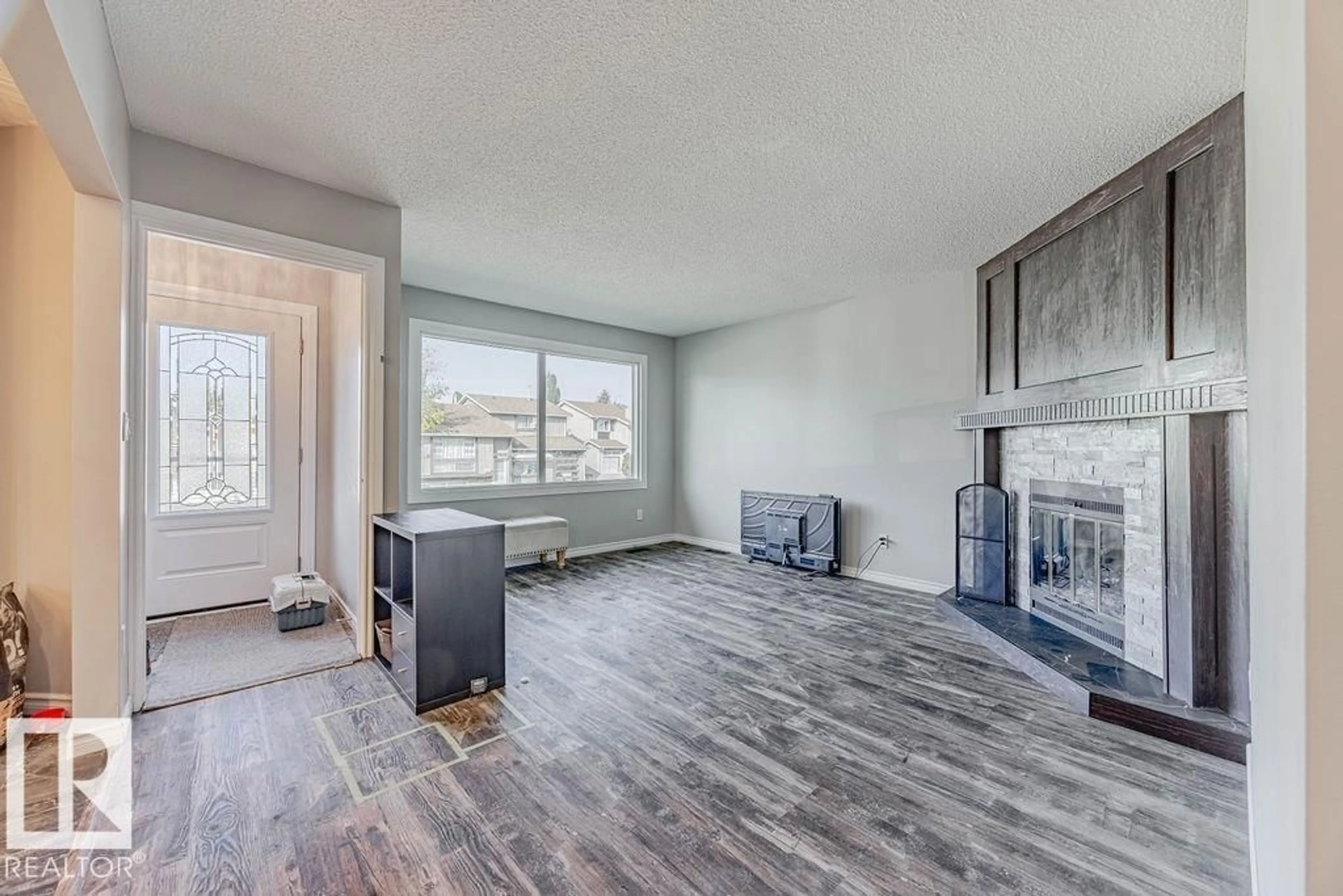 Living room with furniture, wood/laminate floor for 44 WELLINGTON CR, Spruce Grove Alberta T7X1K2