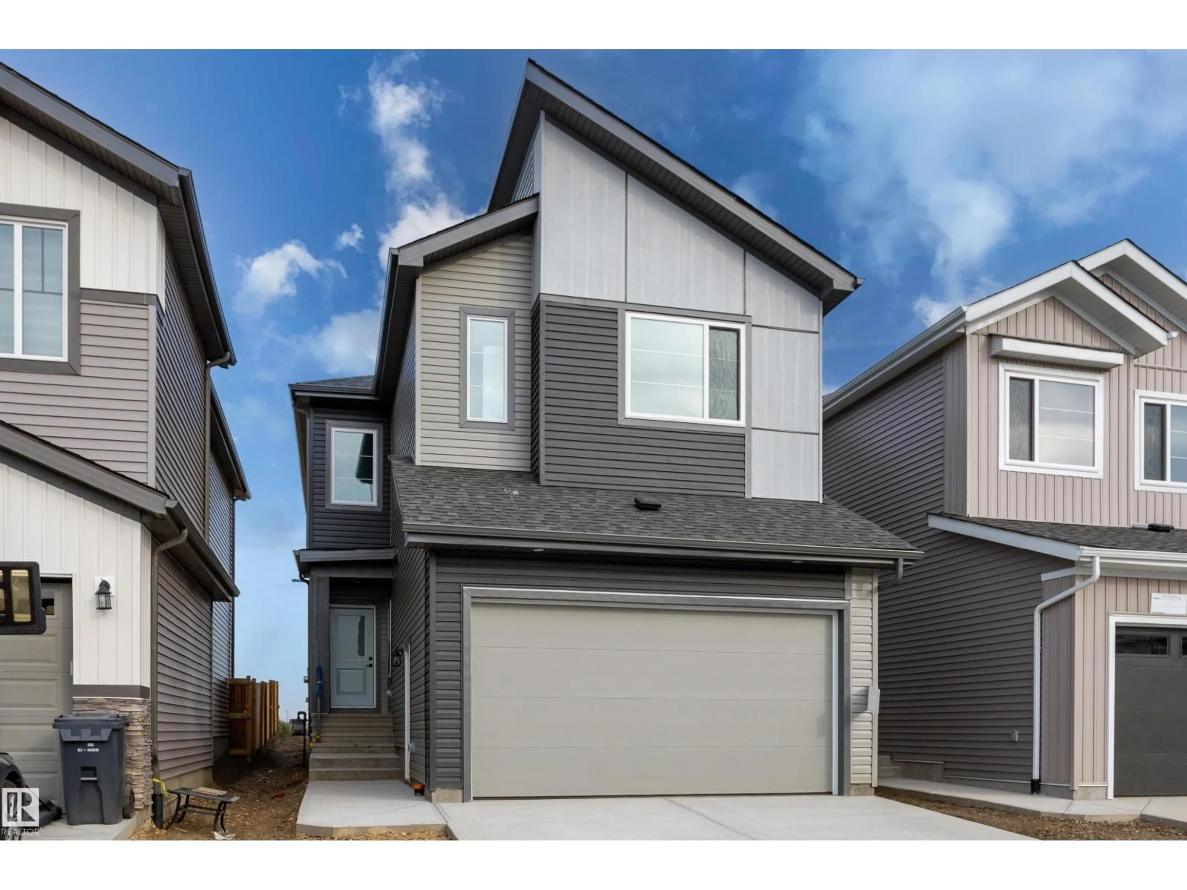 Home with vinyl exterior material, street for 325 BLUFF CV, Leduc Alberta T9E1R5